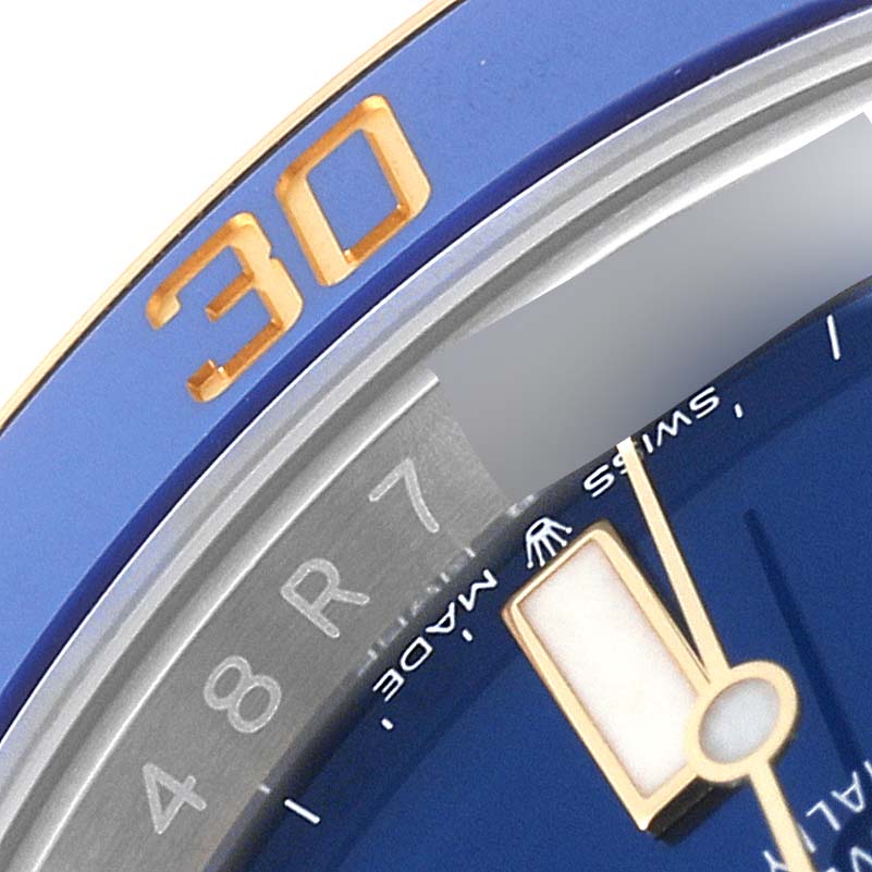 The image shows a close-up of the bezel and dial of a Rolex Submariner 126613 Men's Steel and Gold (two tone) Blue Dial 126613 Men's Steel and Gold (two tone) Blue Dial watch, highlighting the "30" marker.