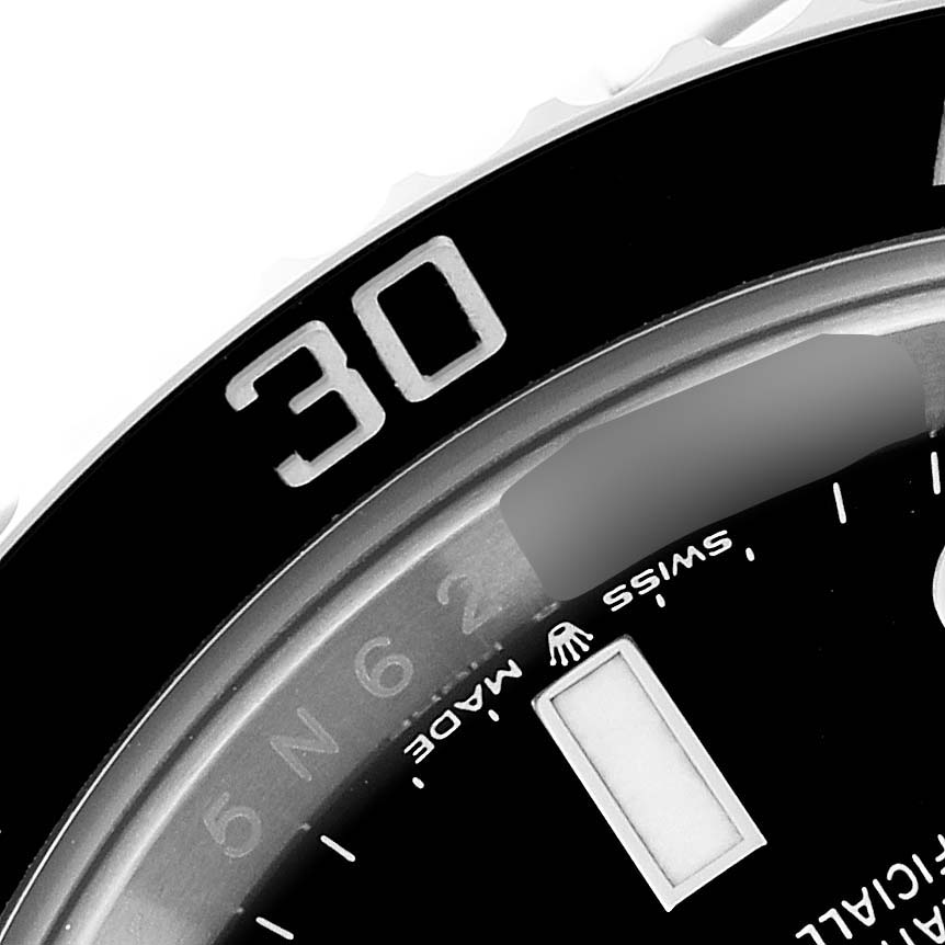 The image shows a close-up of the bezel and part of the dial of a Rolex Submariner 126610LN Men
s Stainless Steel Black Dial 126610LN Men
s Stainless Steel Black Dial watch, highlighting the "30" marker and "Swiss Made" text.