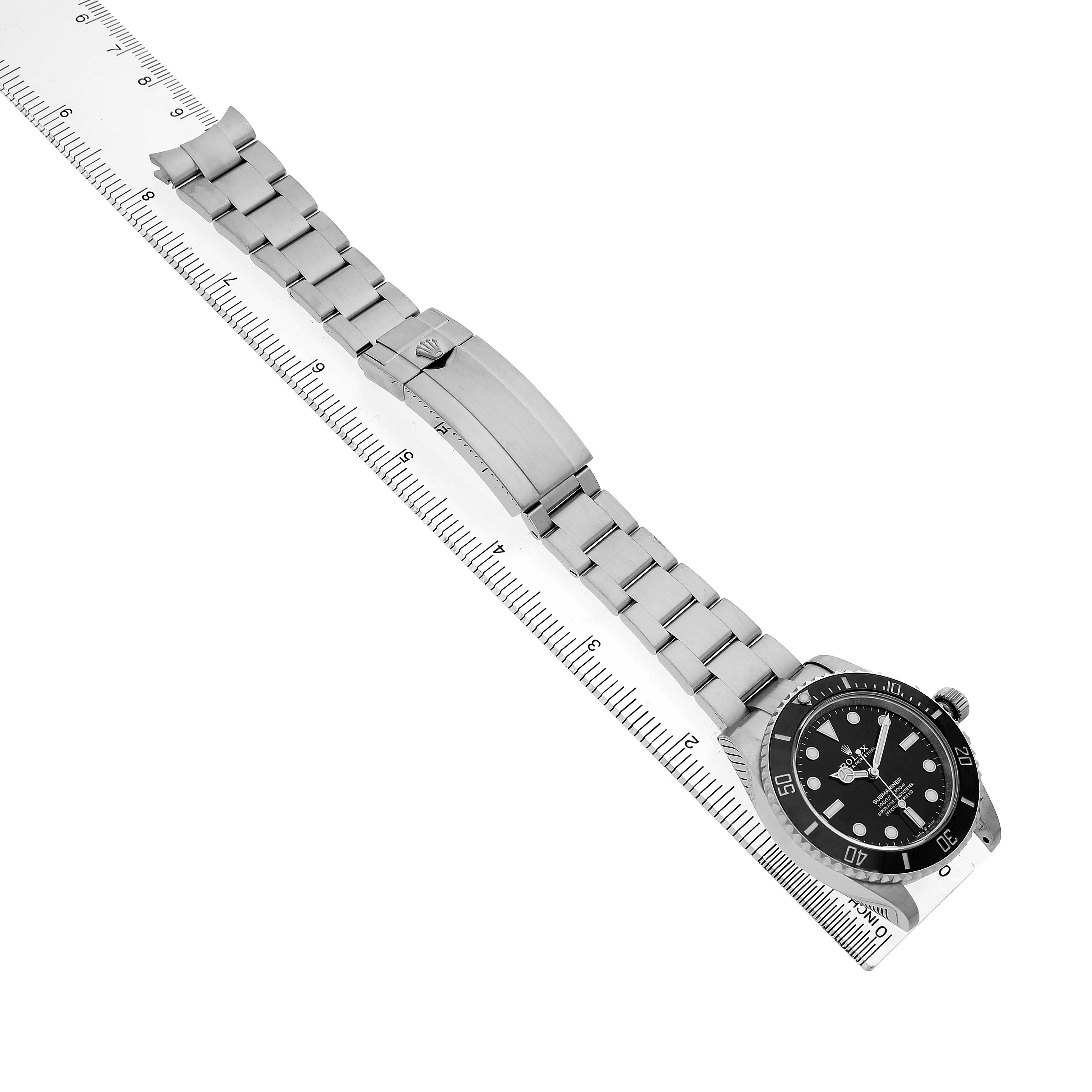 The image shows a top-down view of a Rolex Submariner 124060 Men's Stainless Steel Black Dial, highlighting its full bracelet and clasp, with the watch face visible.