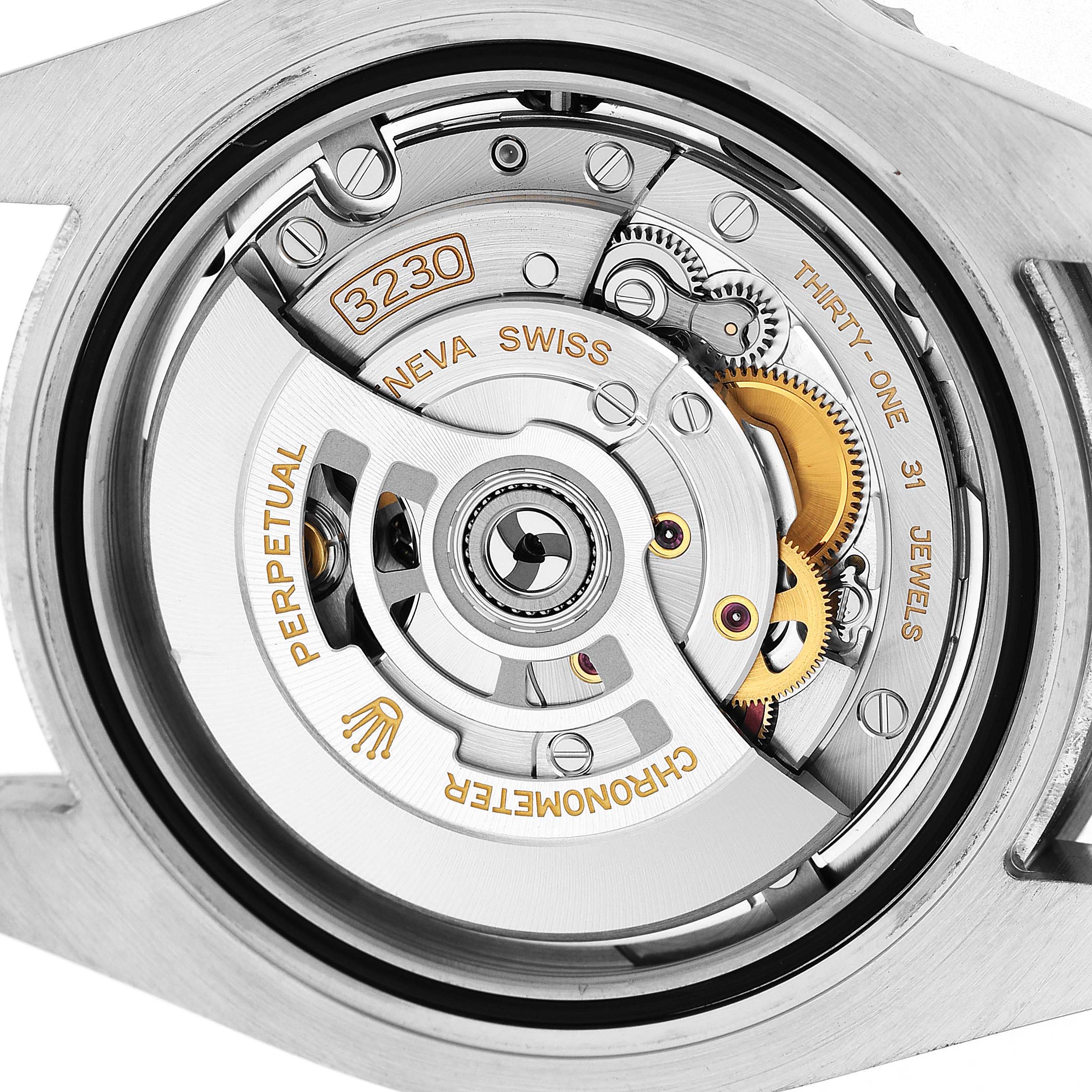 The image shows the open case back angle of a Rolex Submariner 124060 Men's Stainless Steel Black Dial, highlighting its intricate movement mechanism.