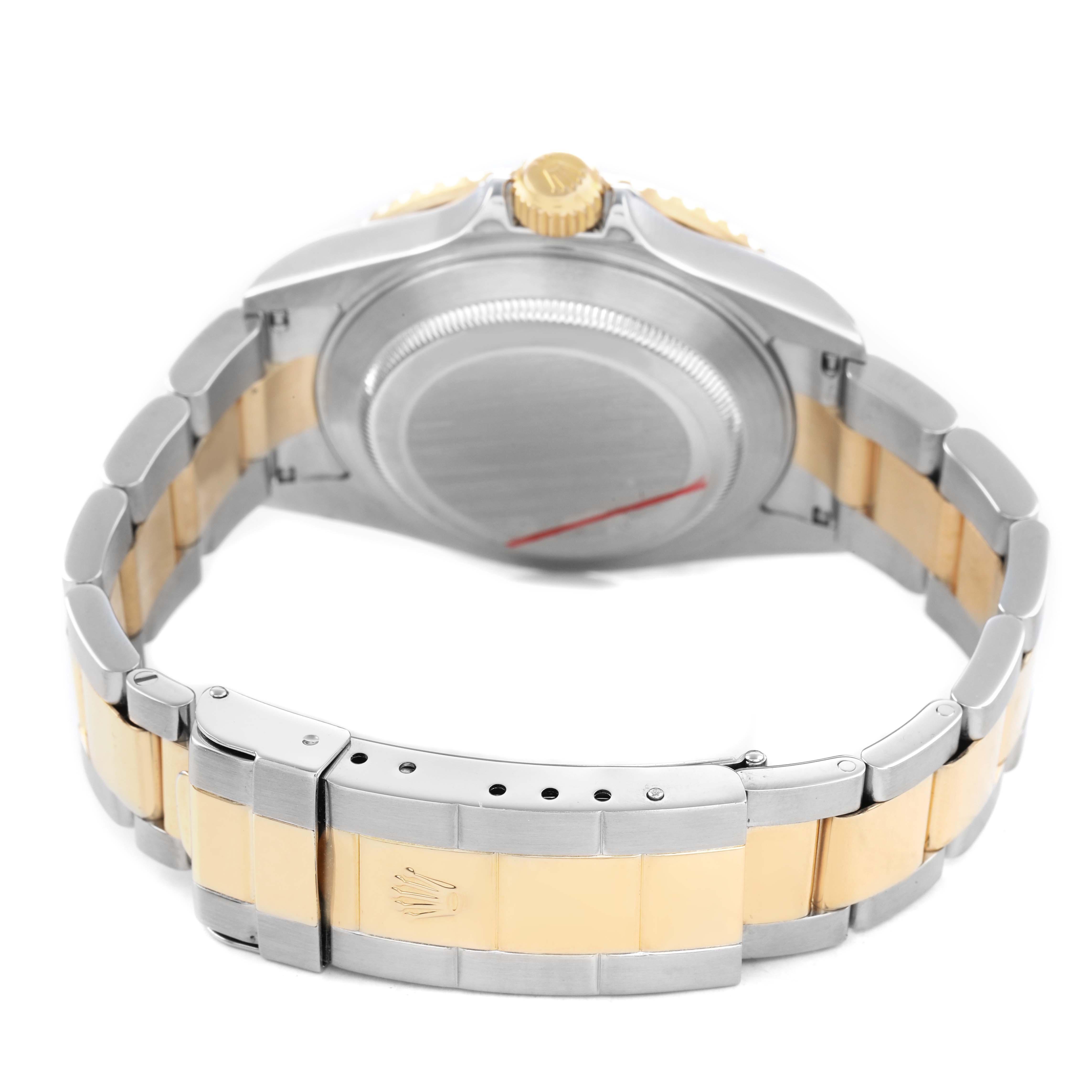 The image shows the Rolex Submariner 16613 Men's Steel and Gold (two tone) Blue Dial from the back, highlighting its two-tone bracelet, clasp, and case back.