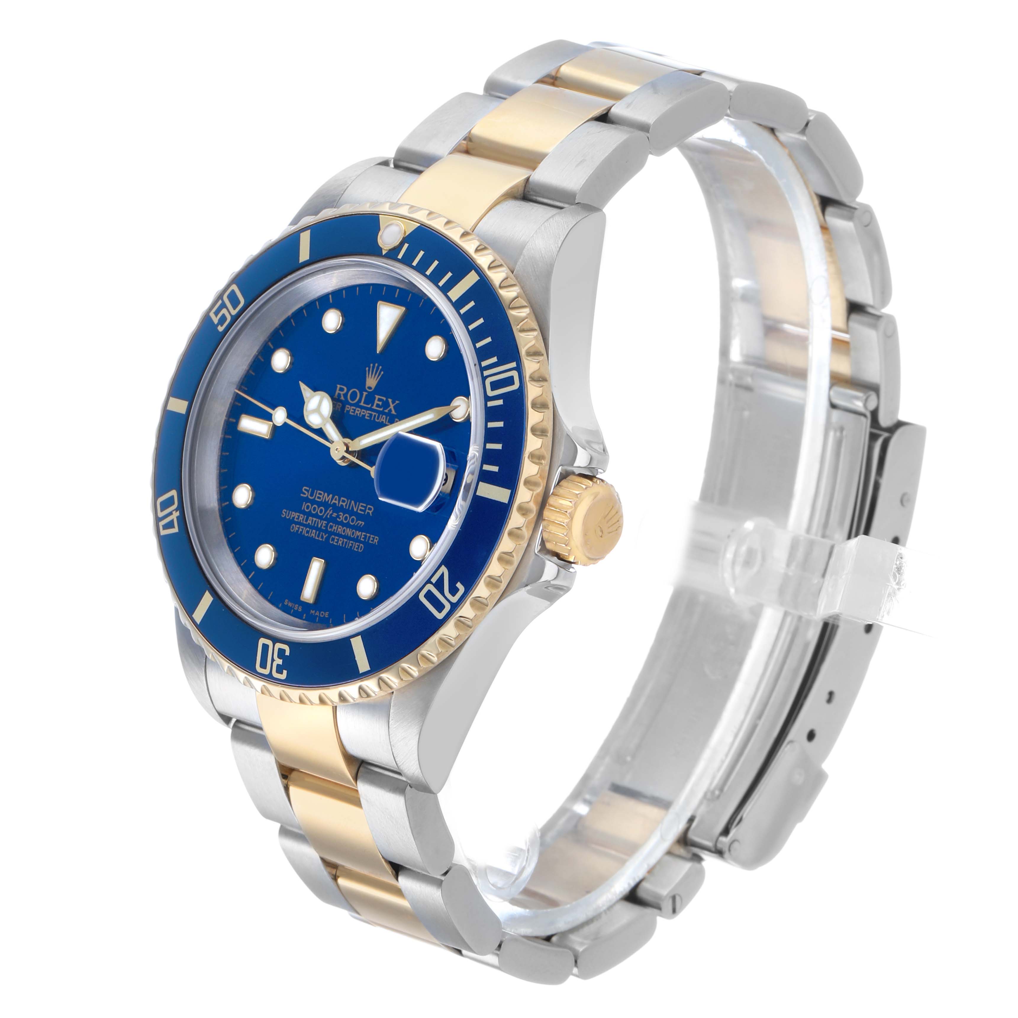 The Rolex Submariner 16613 Men's Steel and Gold (two tone) Blue Dial watch is angled to show the face, bezel, crown, and bracelet.