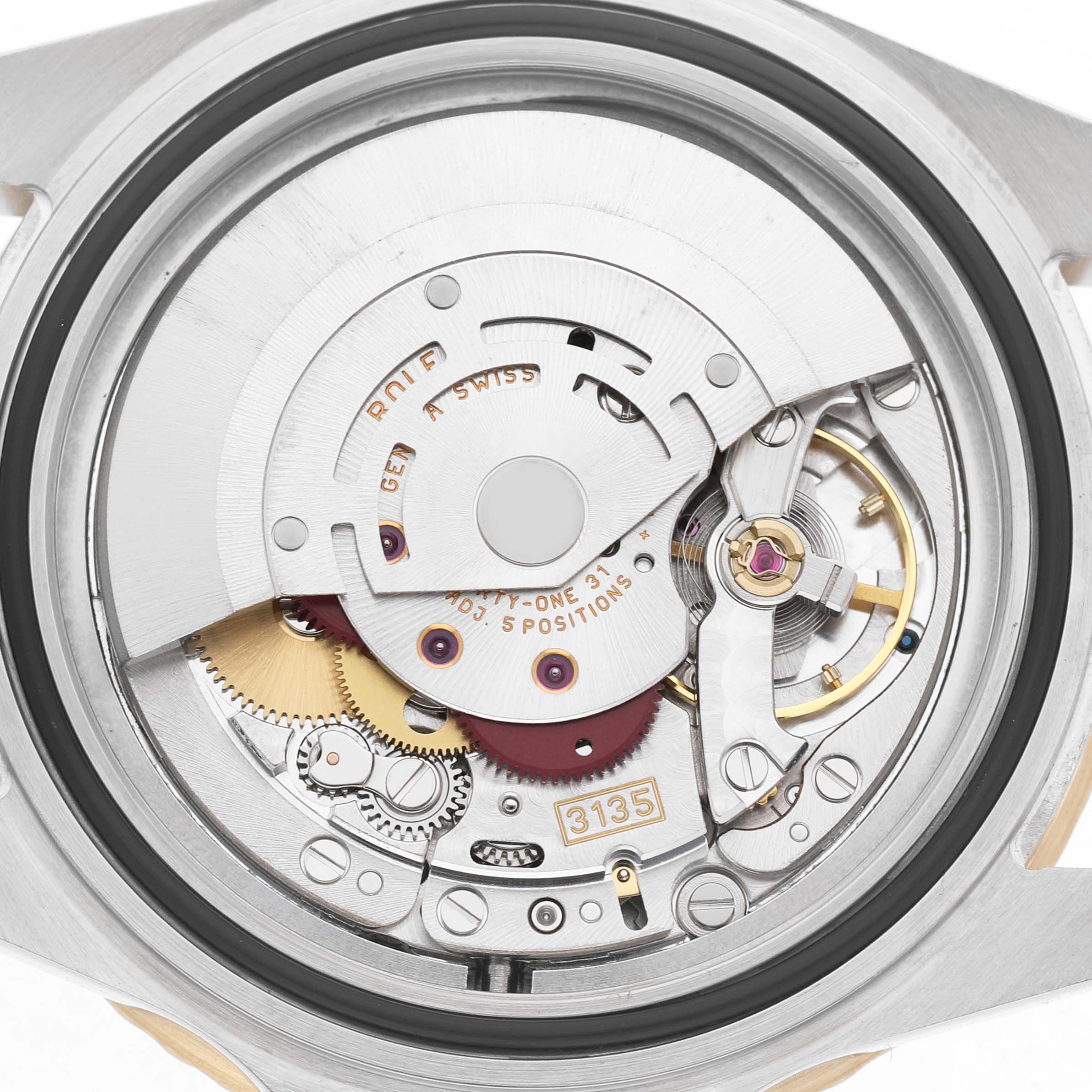 The image shows the movement of a Rolex Submariner 16613 Men's Steel and Gold (two tone) Blue Dial, highlighting gears and the balance wheel from a rear angle.