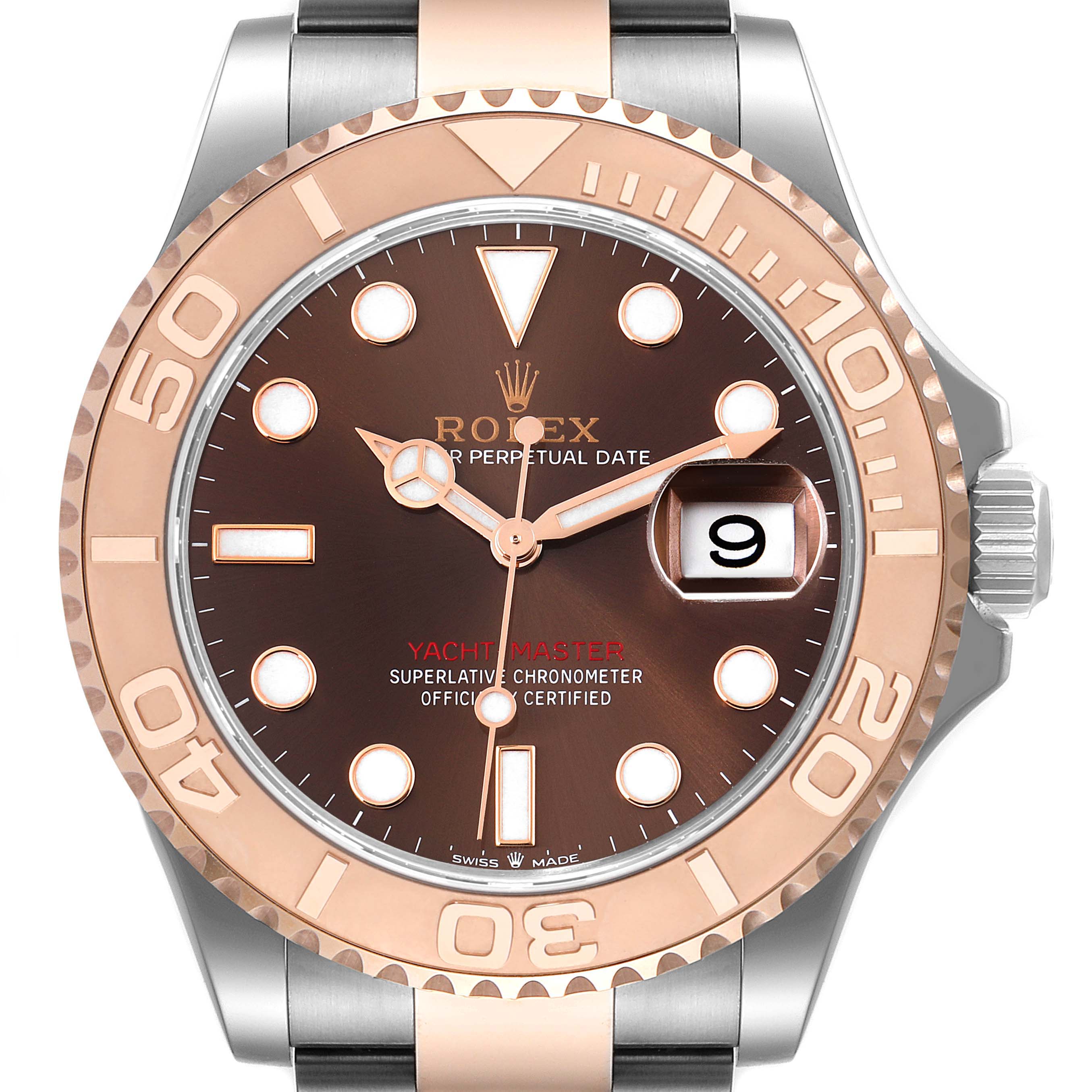 This image shows a close-up of the face and bezel of a Rolex Yacht-Master 126621 Men's Steel and Gold (two tone) Brown Dial 126621 Men's Steel and Gold (two tone) Brown Dial watch with a brown dial and date window.