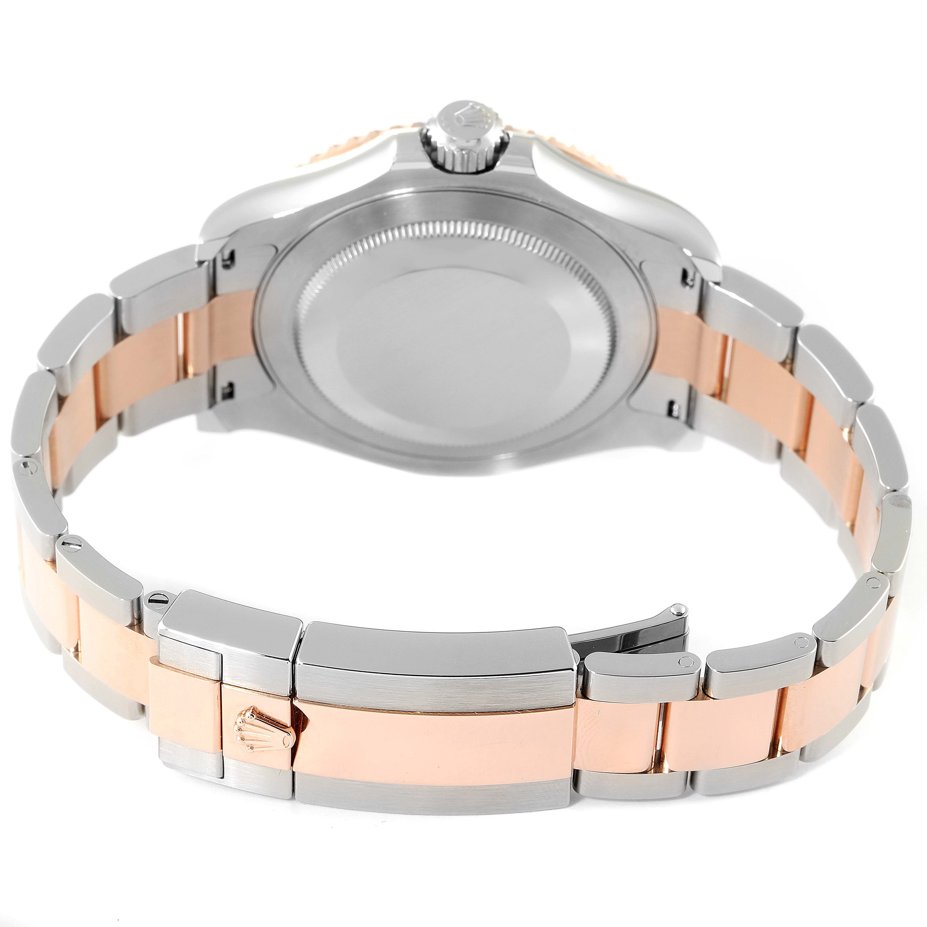 The image shows the back of the Rolex Yacht-Master 126621 Men's Steel and Gold (two tone) Brown Dial 126621 Men's Steel and Gold (two tone) Brown Dial watch, highlighting its case back, crown, and two-tone bracelet with clasp.