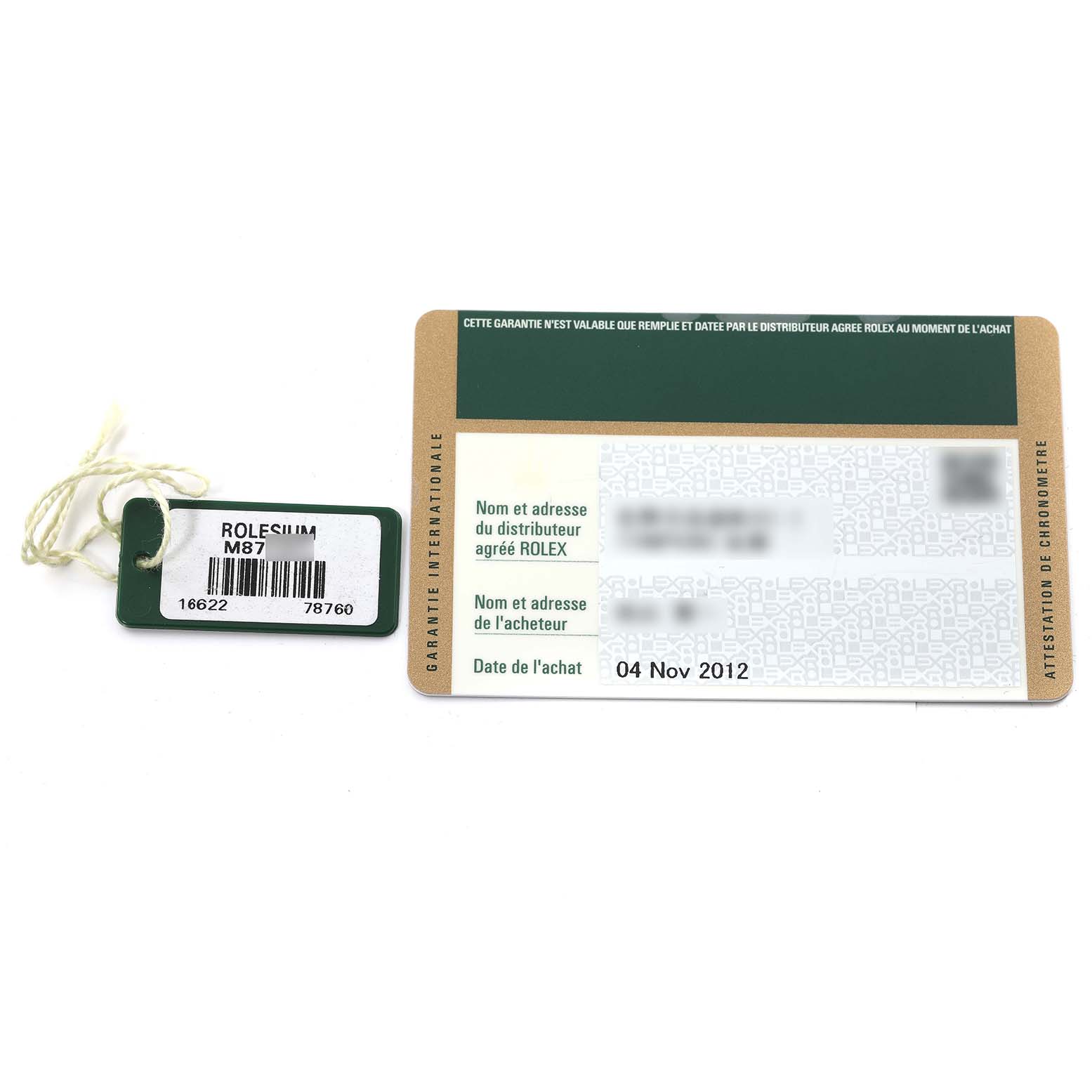 This image shows a Rolex Yacht-Master 16622 Men
s Stainless Steel Silver Dial 16622 Men
s Stainless Steel Silver Dial tag and warranty card with purchase details.