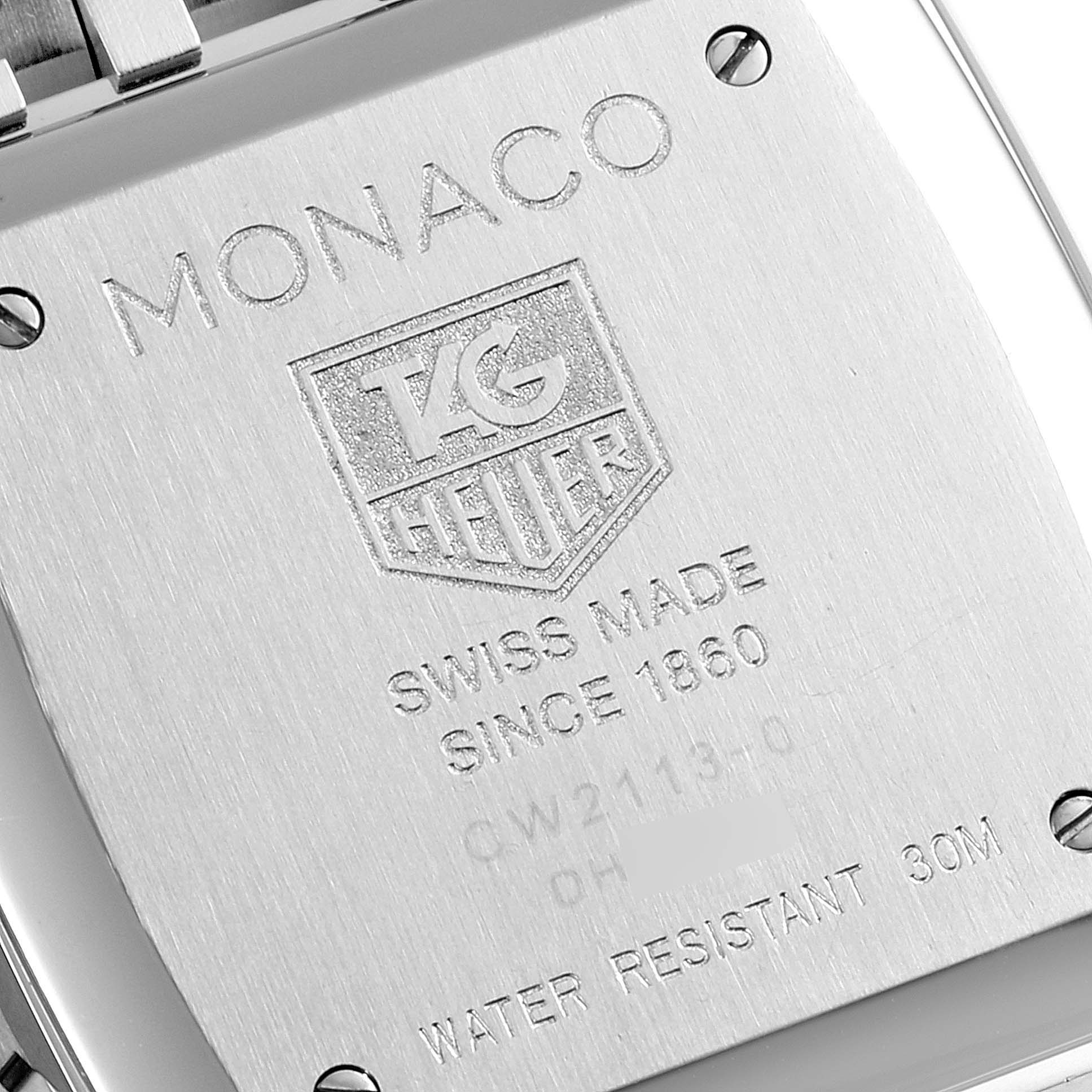 The image shows the back case of a Tag Heuer Monaco CW2113.BA0780 Men
s Stainless Steel Blue Dial CW2113.BA0780 Men
s Stainless Steel Blue Dial watch, highlighting engravings detailing its specifications.