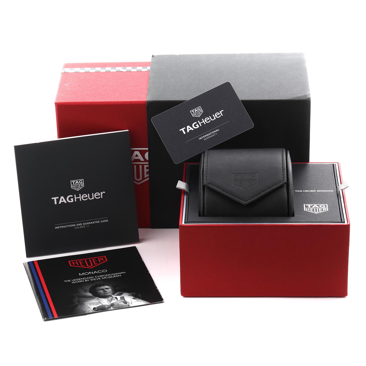 The image displays the packaging, travel pouch, instructions, and guarantee card for the Tag Heuer Monaco CAW211P.FC6356 Men
s Stainless Steel Blue Dial CAW211P.FC6356 Men
s Stainless Steel Blue Dial watch.
