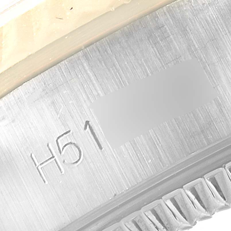 The image shows a close-up of the engraving on the metal casing edge of the Tudor Princess 92513 Women's Steel and Gold (two tone) Silver Dial 92513 Women's Steel and Gold (two tone) Silver Dial watch model.