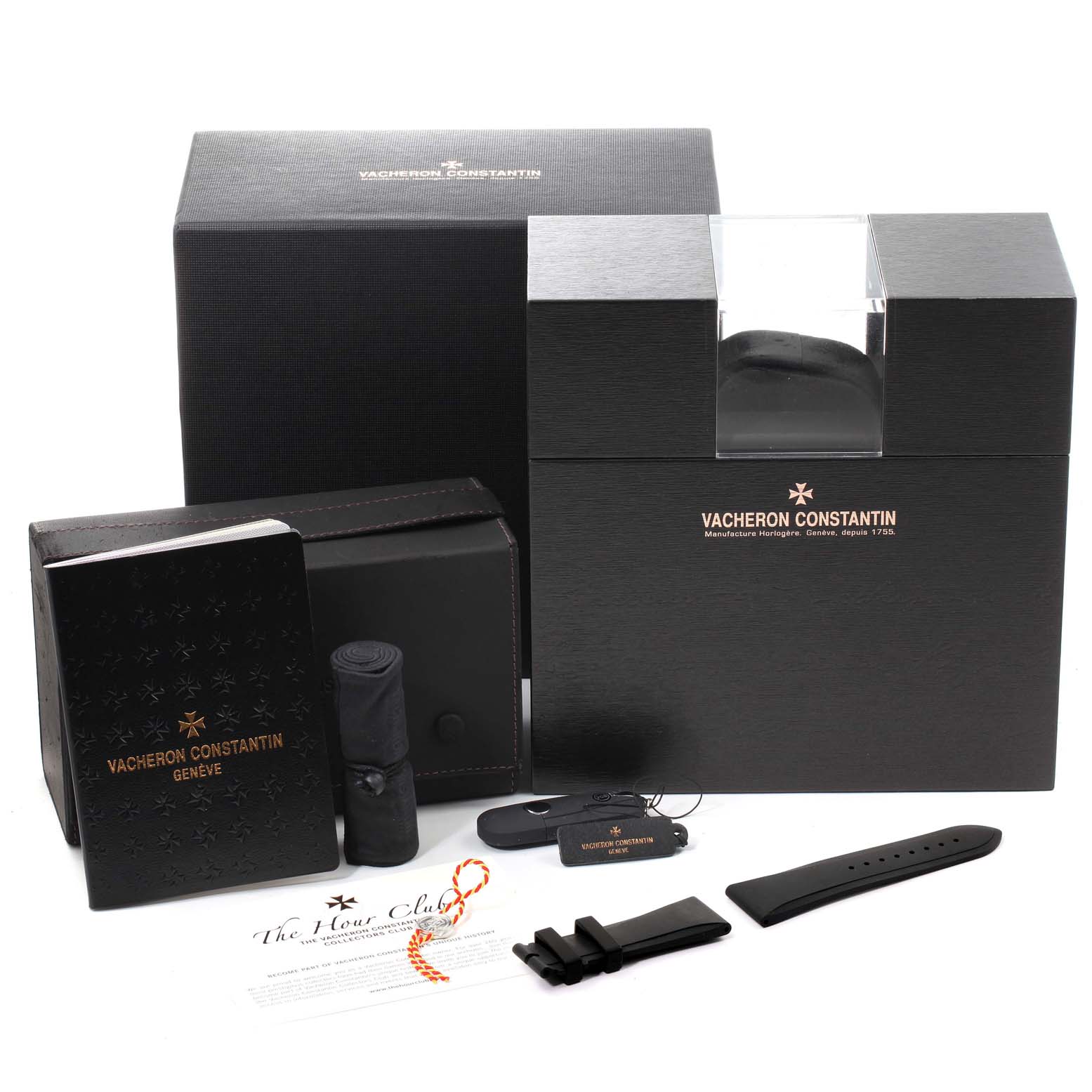 The image shows the packaging and accessories of the Vacheron Constantin Quai de l'Ile watch, including additional straps and documentation.