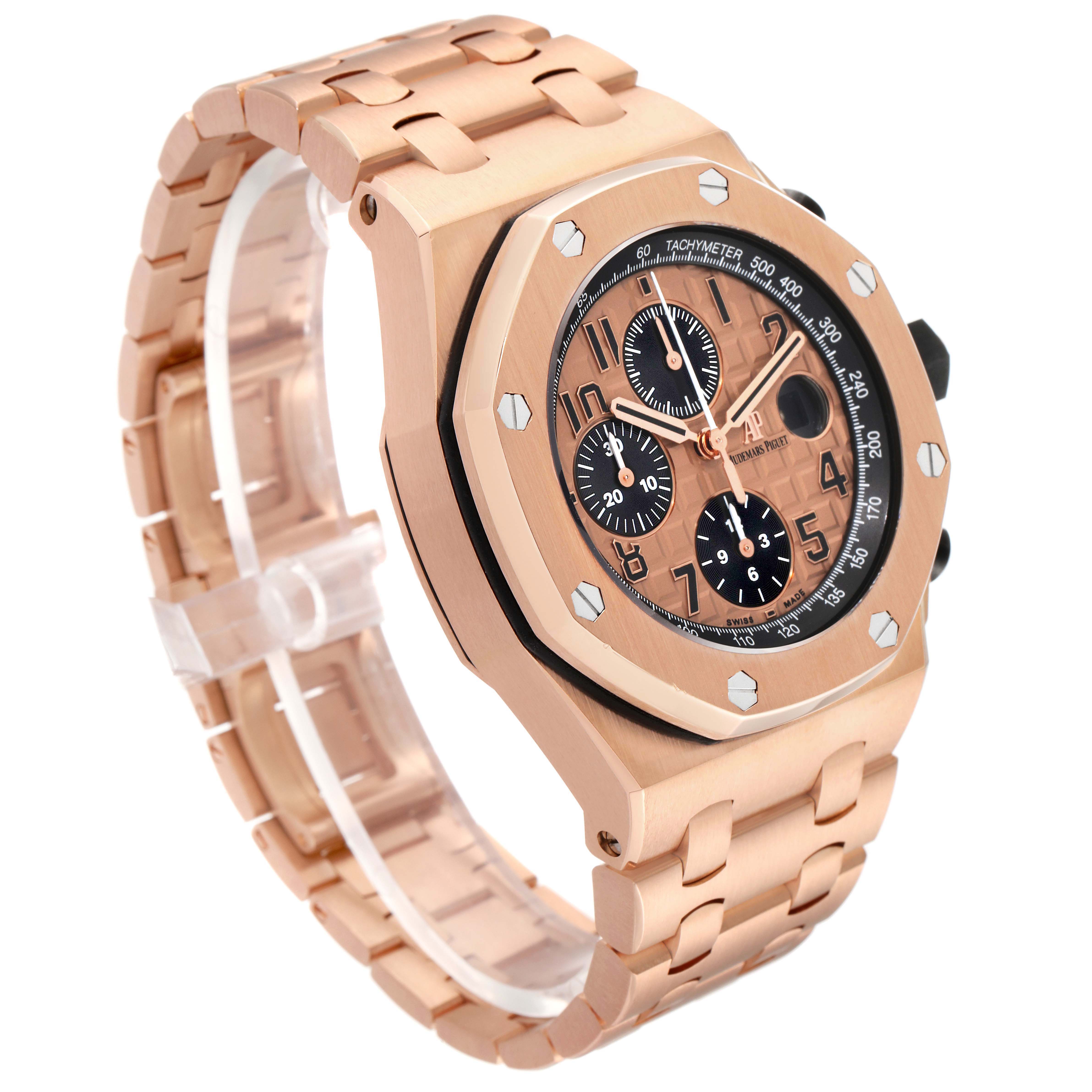 The Audemars Piguet Royal Oak Offshore 26470OR.OO.1000OR.01 Men's Rose Gold Pink Dial watch is shown from a three-quarter angle, highlighting the case, bezel, dial, and bracelet.