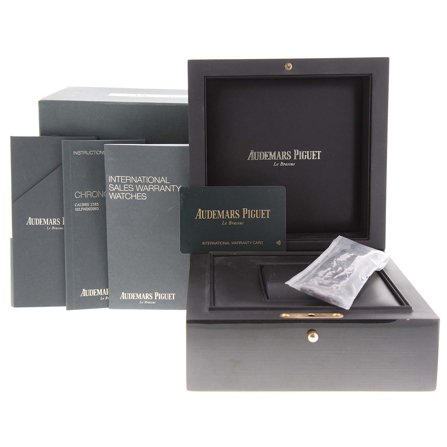 The image shows the packaging and accessories, including manuals and warranty card, for the Audemars Piguet Royal Oak 26331OR.OO.D821CR.01 Men's Rose Gold Brown Dial 26331OR.OO.D821CR.01 Men's Rose Gold Brown Dial watch.