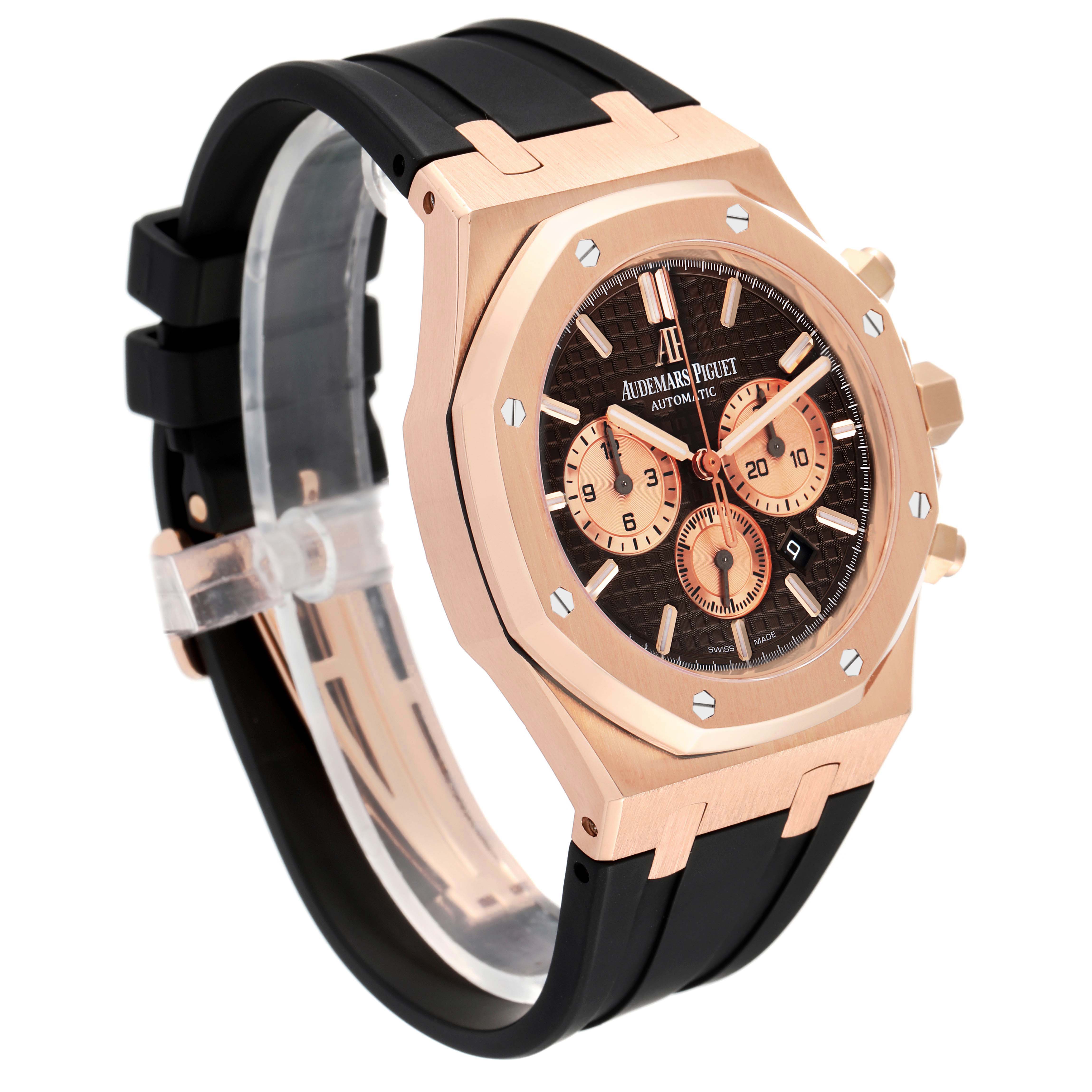 The image shows a side-angle view of an Audemars Piguet Royal Oak 26331OR.OO.D821CR.01 Men's Rose Gold Brown Dial 26331OR.OO.D821CR.01 Men's Rose Gold Brown Dial watch, highlighting its rose gold case, black strap, and chronograph dials.