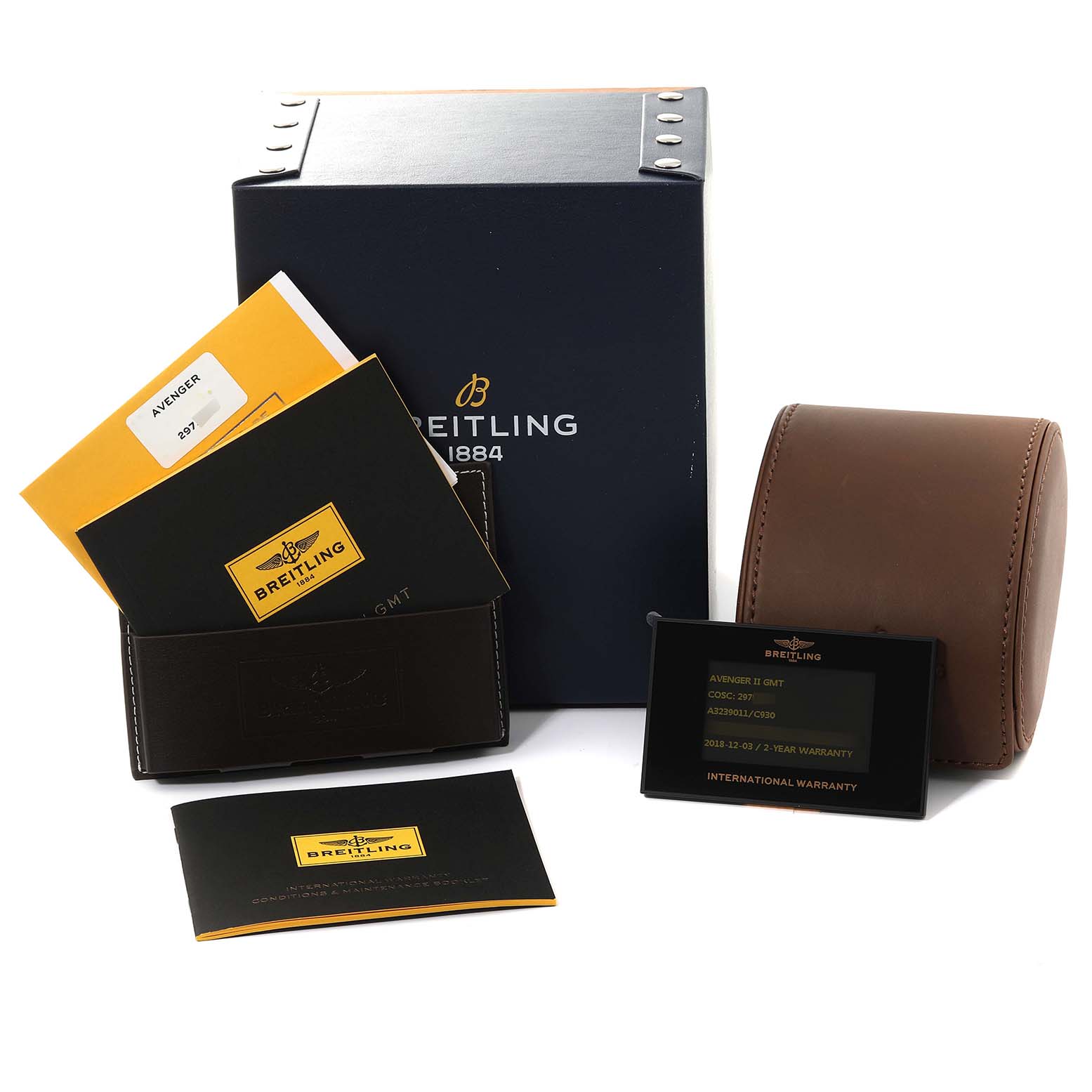 The image shows the packaging, documents, and warranty card for the Breitling Avenger A3239011/C930 Men's Stainless Steel Mother of Pearl Dial A3239011/C930 Men's Stainless Steel Mother of Pearl Dial watch, along with a brown leather pouch.