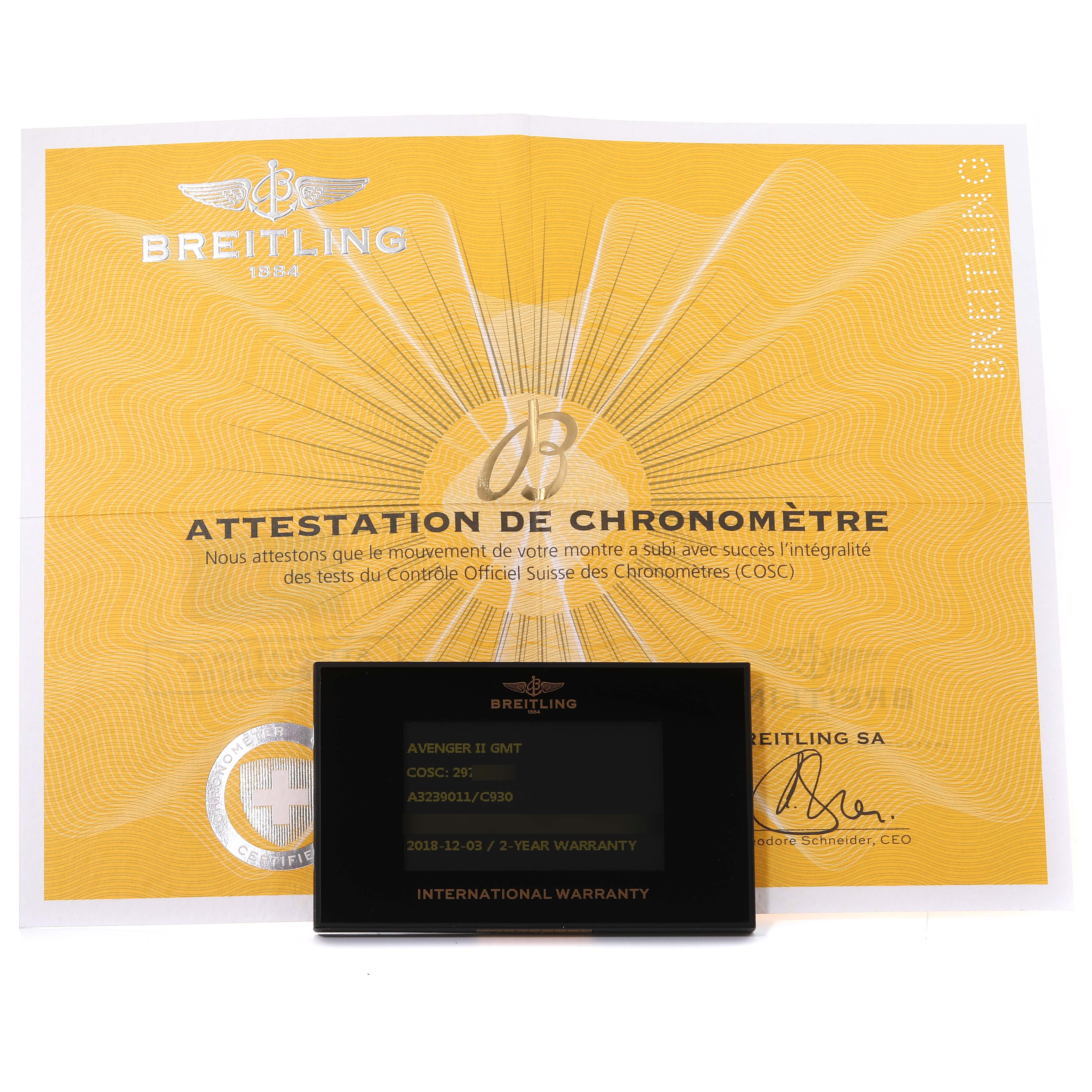 The image displays a Breitling Avenger A3239011/C930 Men's Stainless Steel Mother of Pearl Dial A3239011/C930 Men's Stainless Steel Mother of Pearl Dial II GMT warranty card and a COSC certification document against a yellow background.
