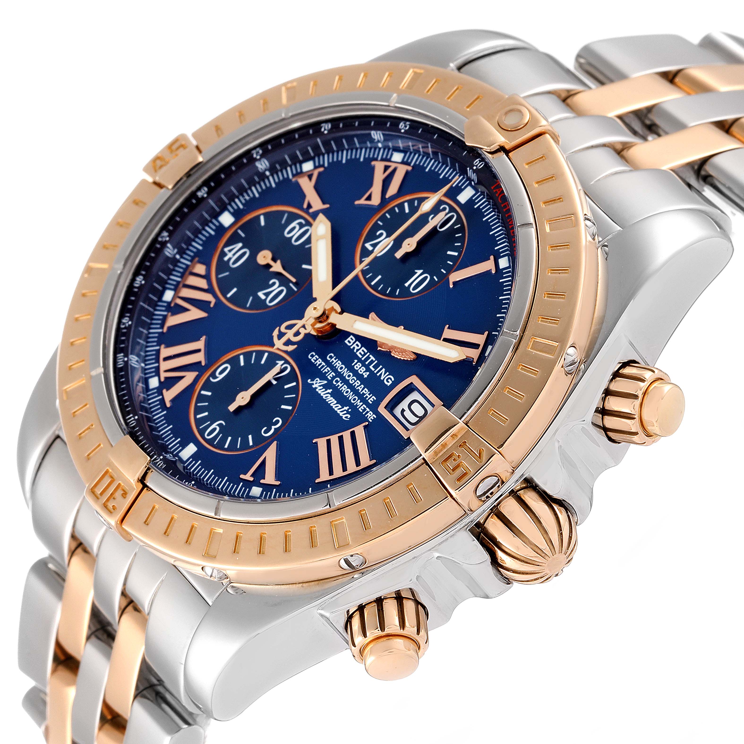 This Breitling Chronomat C13356 Men
s Steel and Gold (two tone) Blue Dial C13356 Men
s Steel and Gold (two tone) Blue Dial watch is shown from an angle emphasizing the dial, crown, and bezel.
