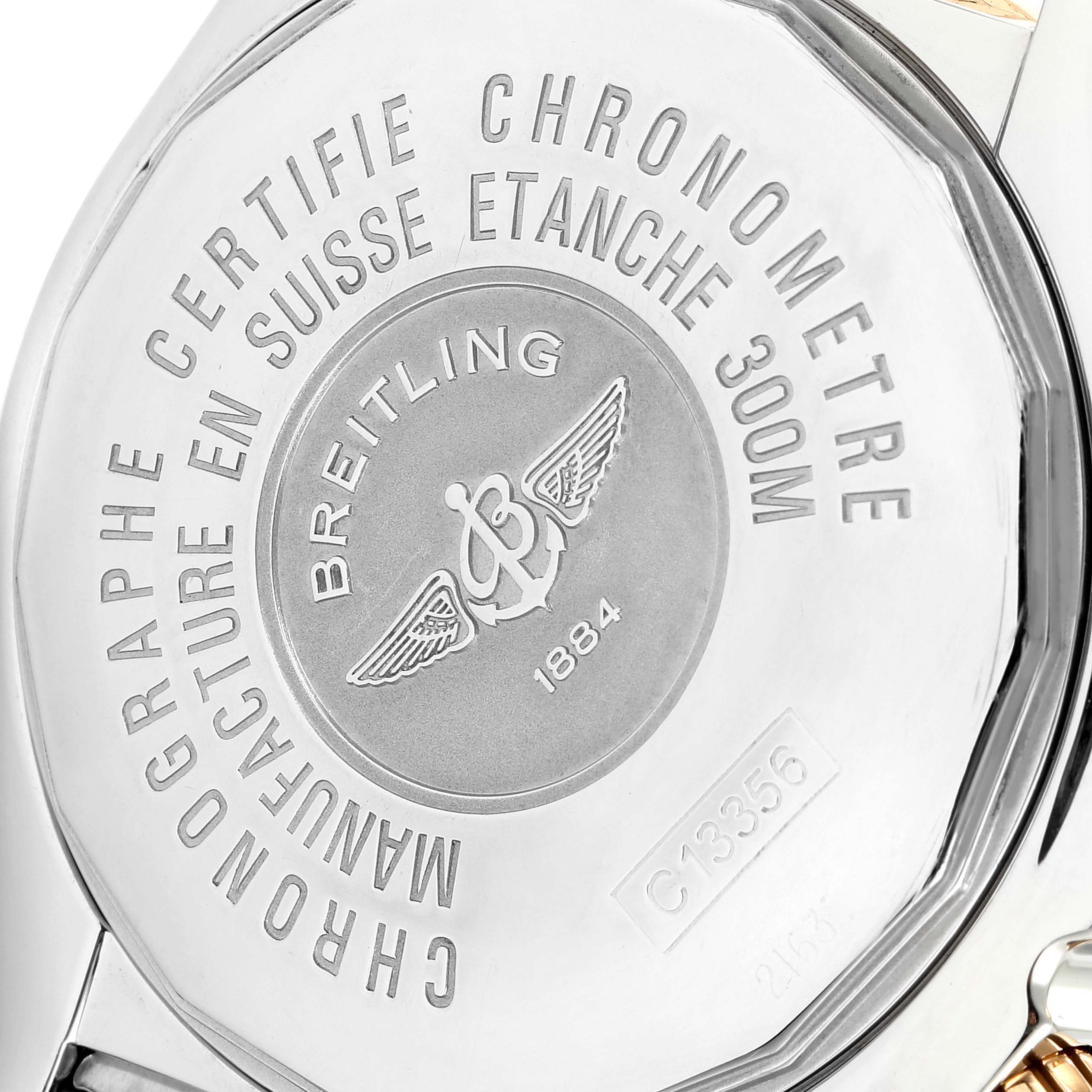 The image shows the back case of a Breitling Chronomat C13356 Men
s Steel and Gold (two tone) Blue Dial C13356 Men
s Steel and Gold (two tone) Blue Dial watch, highlighting its engravings and logo.