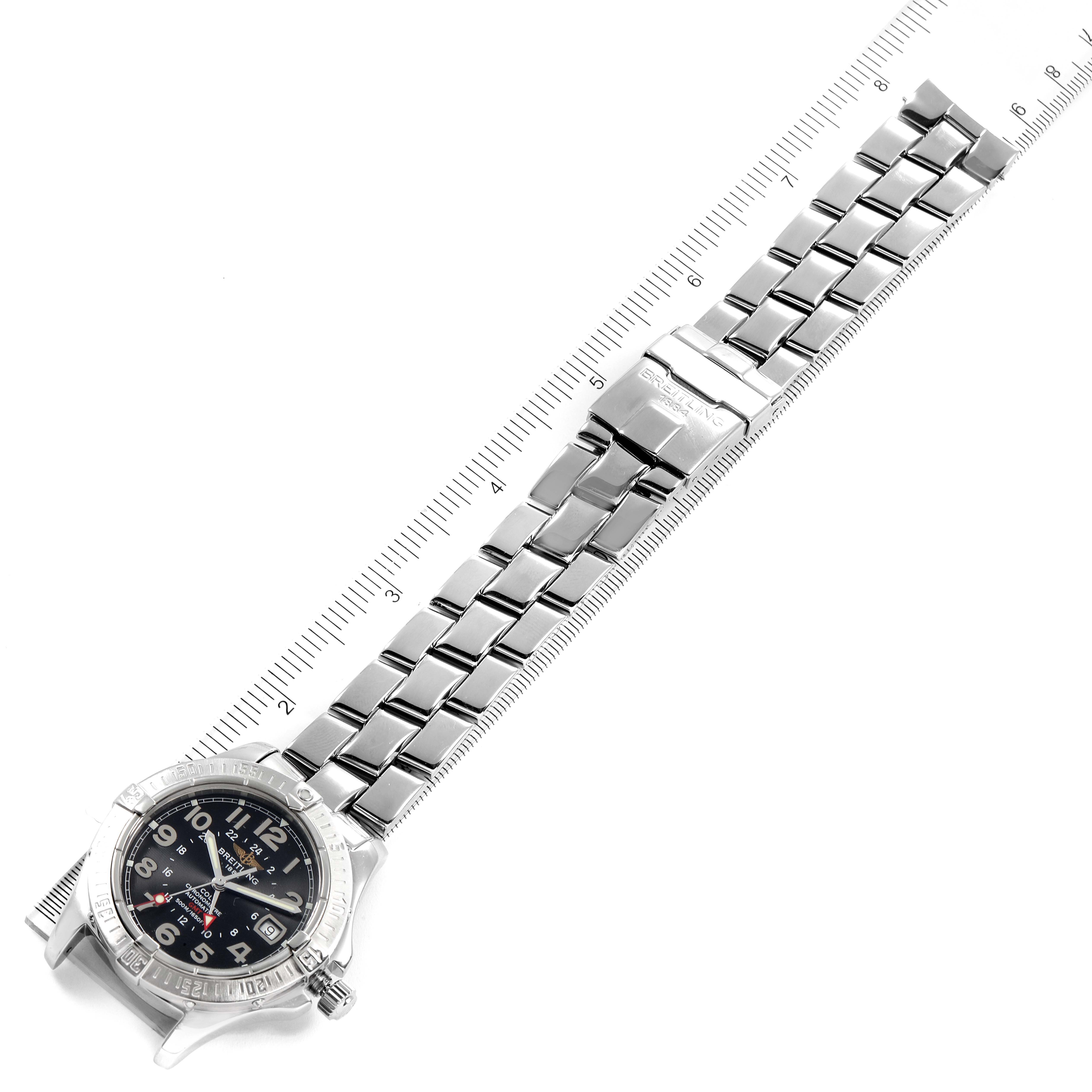 This image shows a top view of the Breitling Colt A32350 Men's Stainless Steel Black Dial A32350 Men's Stainless Steel Black Dial watch, displaying its dial, bezel, and metal bracelet against a measuring scale.