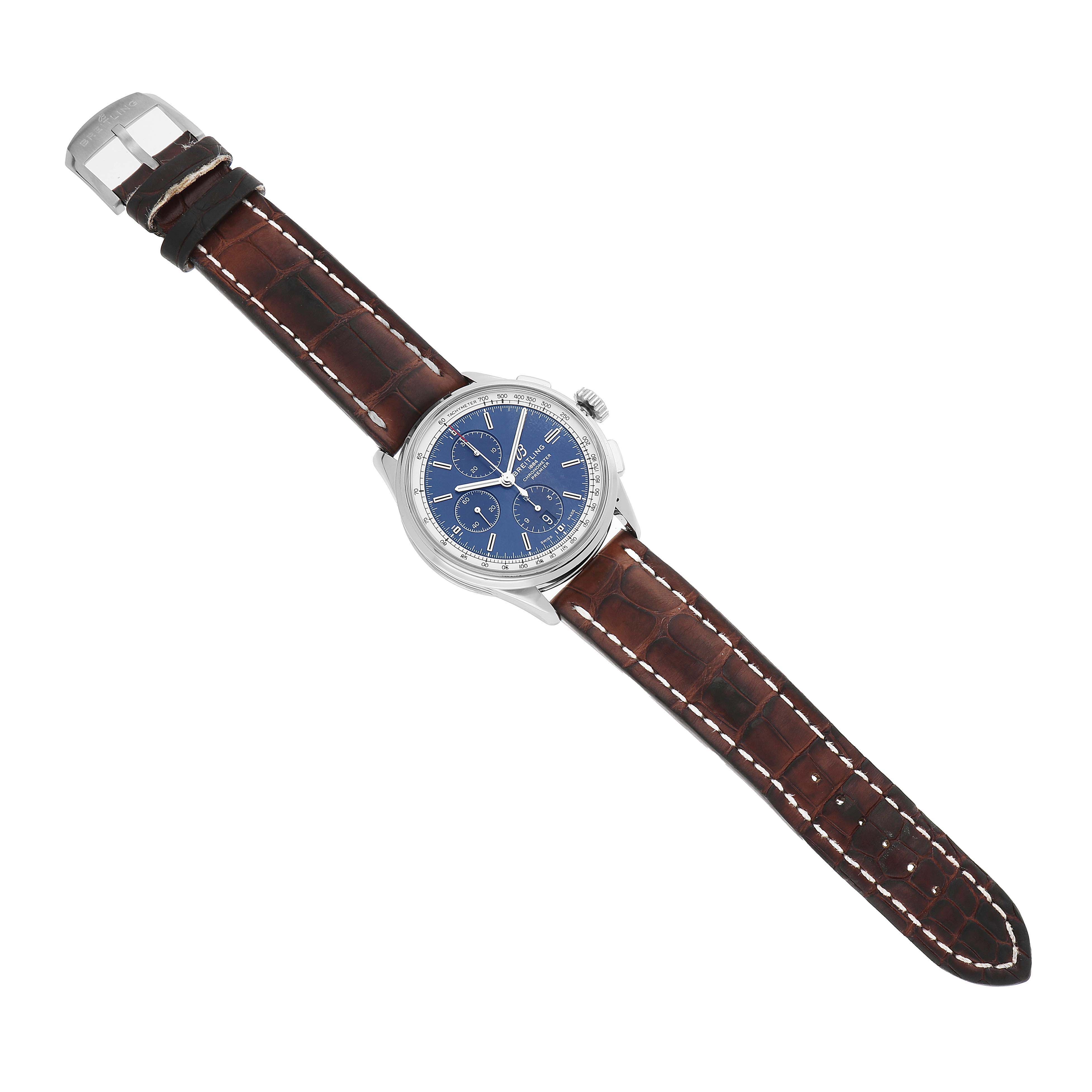 The Breitling Premier A13315 Men's Stainless Steel Blue Dial watch is shown from an overhead angle, displaying its blue dial, brown leather strap, and stainless steel case.