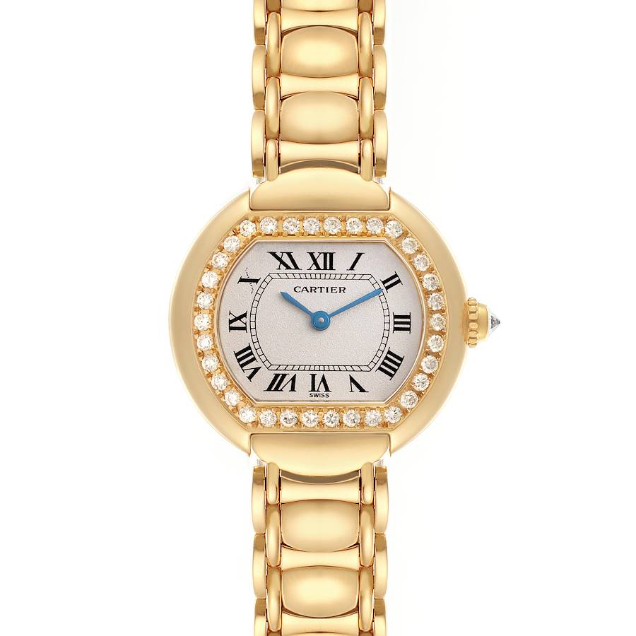 The Cartier Tortue watch is shown from a top-down angle, highlighting the face, bezel, and part of the bracelet.
