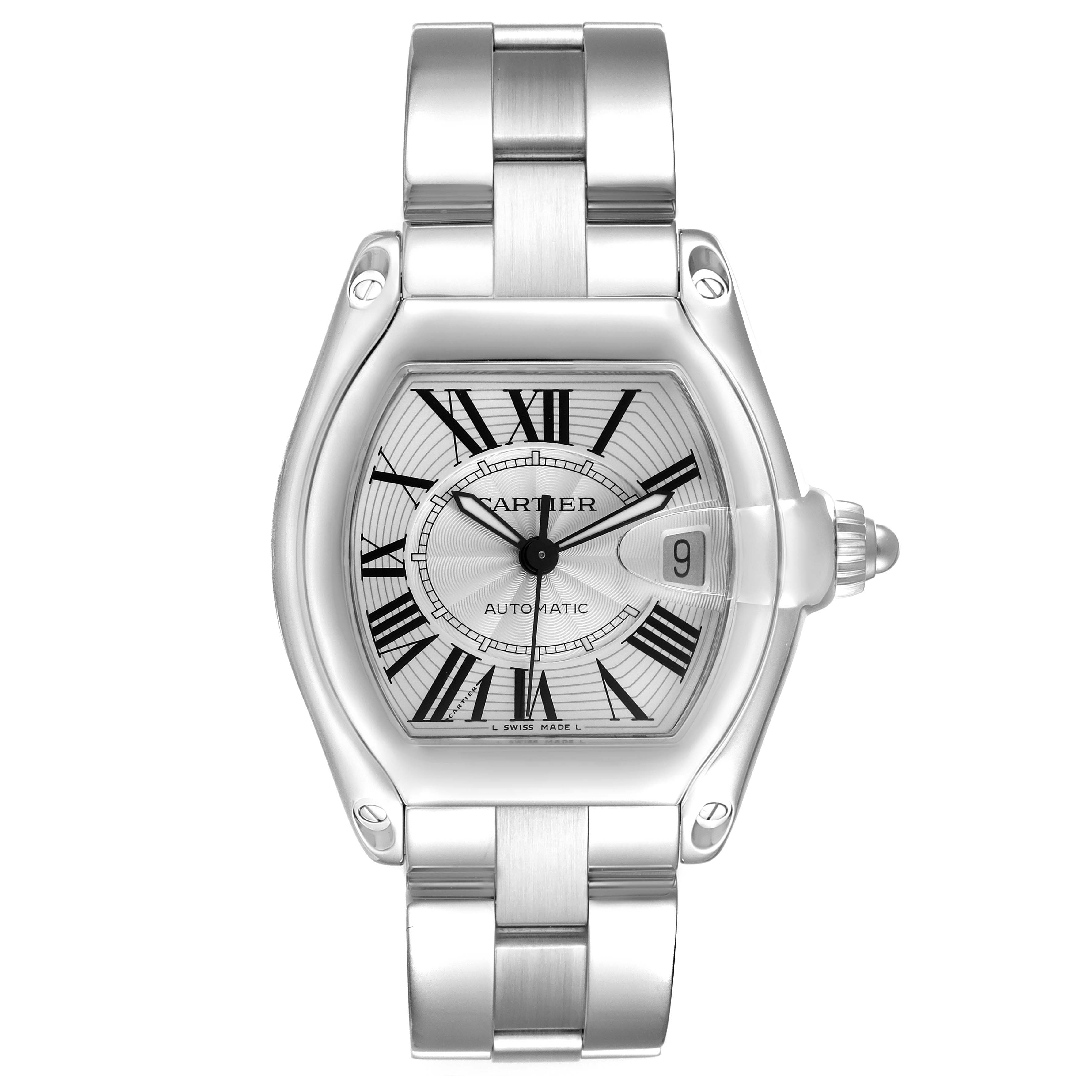 The Cartier Roadster W62025V3 Men
s Stainless Steel Silver Dial W62025V3 Men
s Stainless Steel Silver Dial watch is shown from a top-down angle, displaying the face, bracelet, and date magnifier prominently.