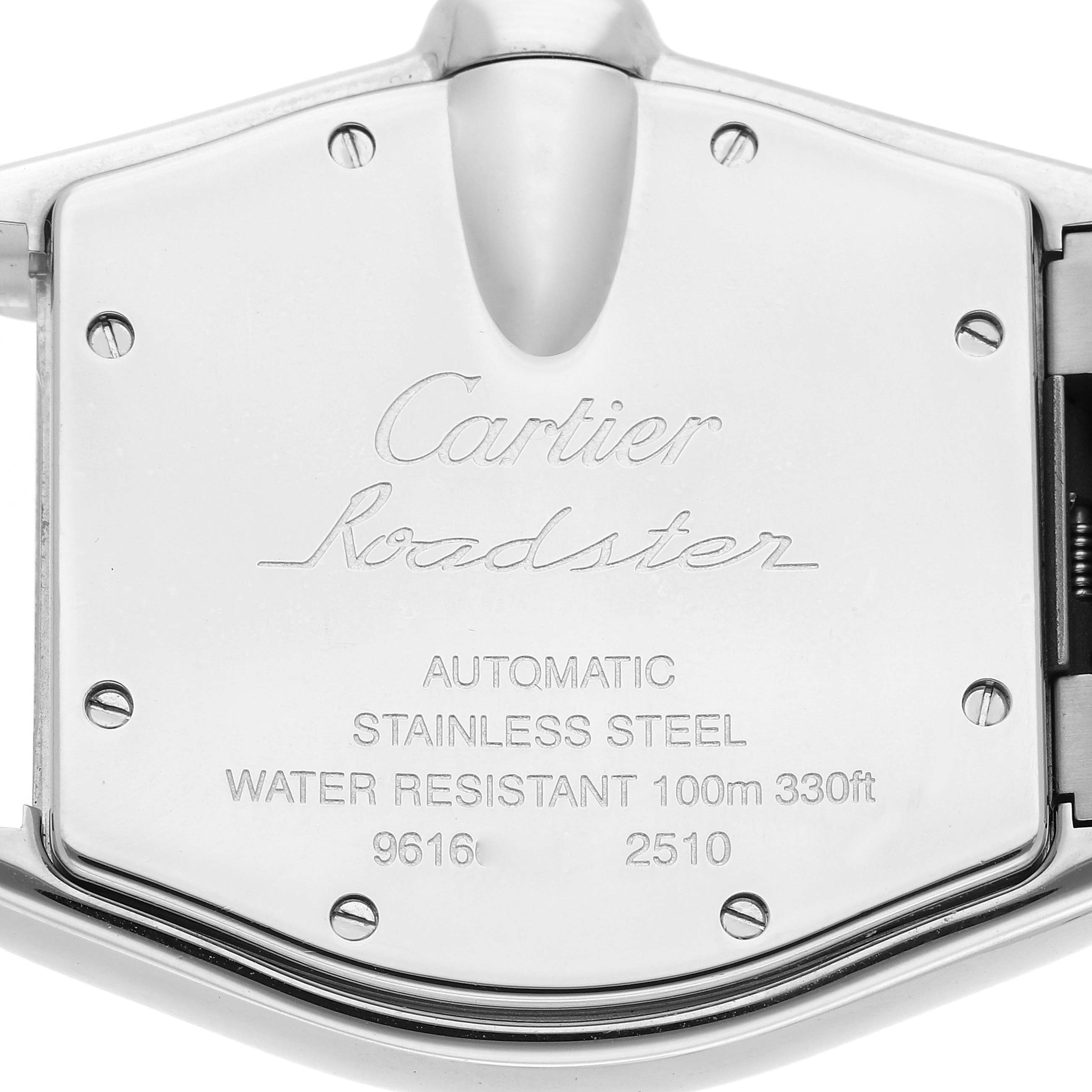 The image shows the back case of a Cartier Roadster W62025V3 Men
s Stainless Steel Silver Dial W62025V3 Men
s Stainless Steel Silver Dial watch, featuring engraved details and screws.