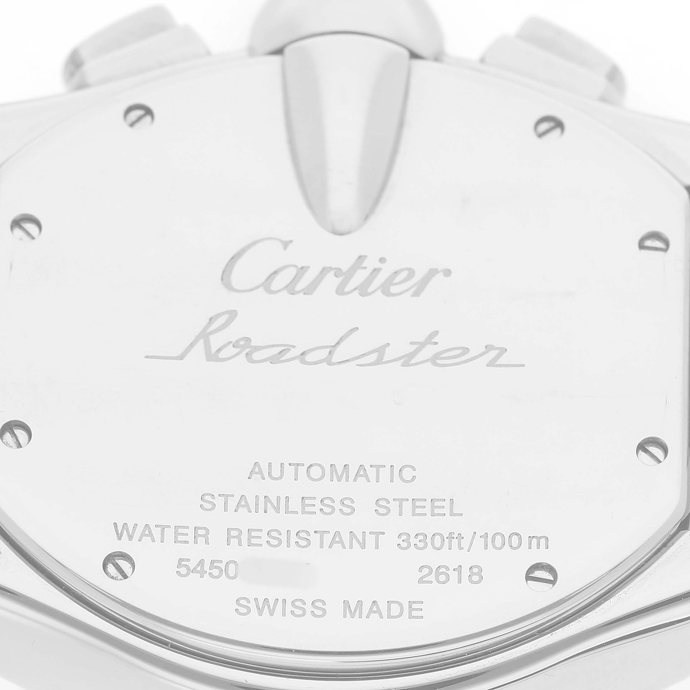 The image shows the back of the Cartier Roadster W62019X6 Men's Stainless Steel Silver Dial watch, highlighting the engravings and material details.