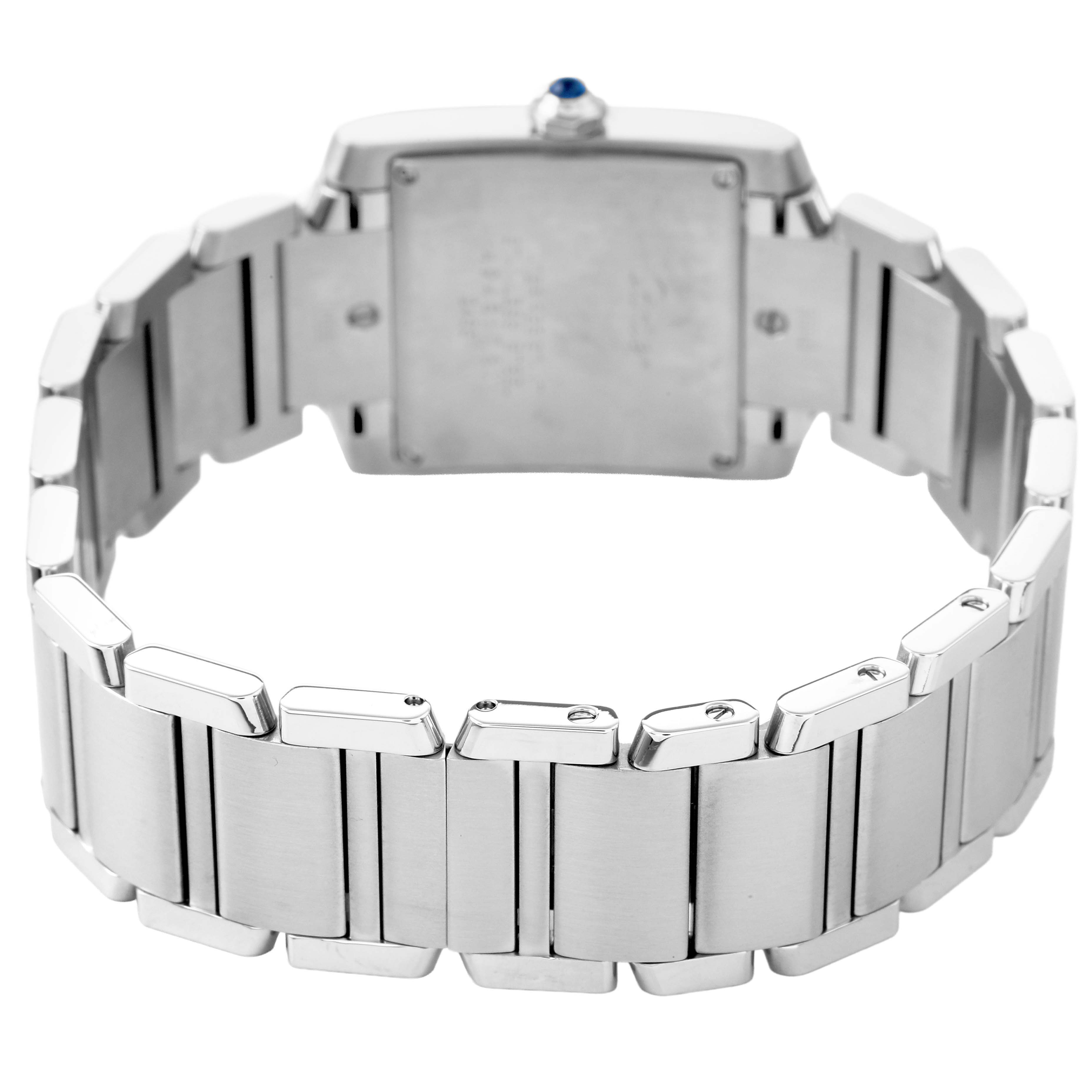 The image shows the Tank Française by Cartier from the back, highlighting the metal bracelet and rear side of the watch case.