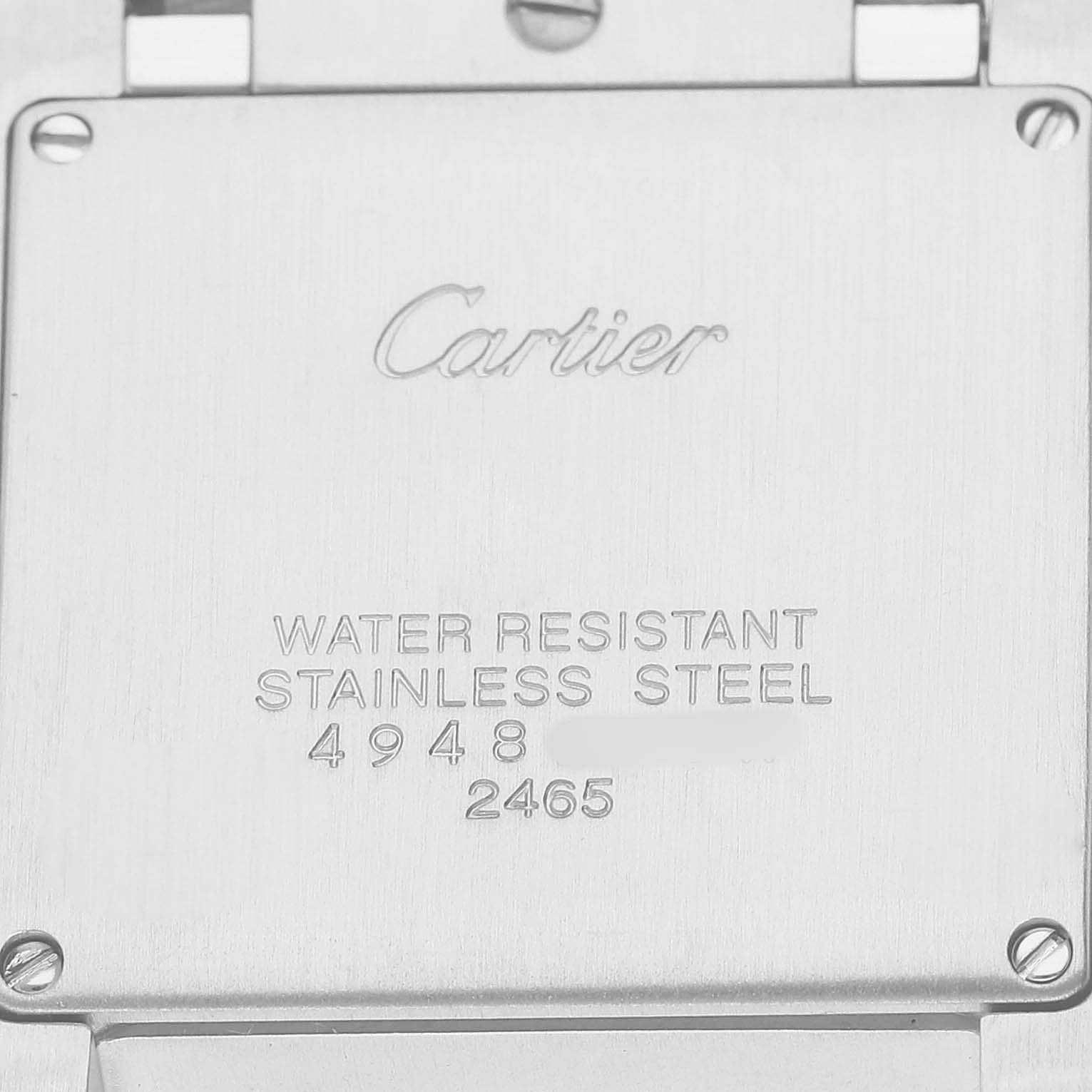 The image shows the back case of a Cartier Tank Francaise W51011Q3 Women's Stainless Steel Silver Dial watch, highlighting the brand engraving and specifications.