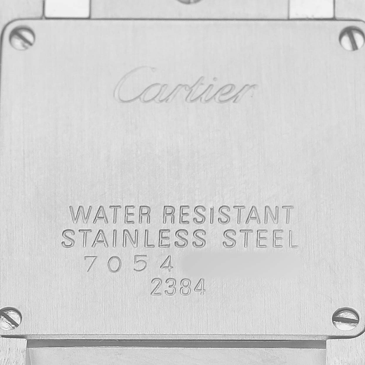 The image shows the back of the Cartier Tank Francaise W51031Q3 Women's Stainless Steel Silver Dial, highlighting its water resistance and stainless steel features.
