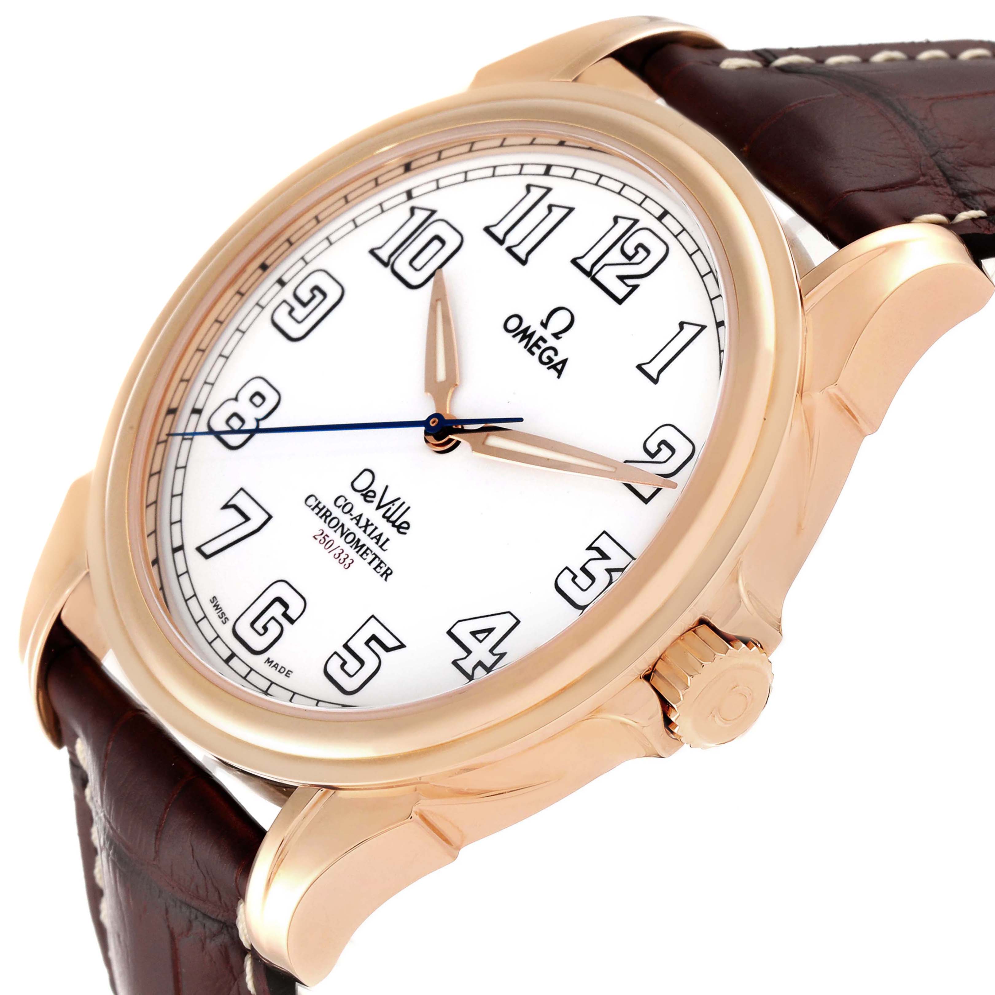 The image shows an angled view of an Omega De Ville 4660.20.32 Men's Rose Gold White Dial 4660.20.32 Men's Rose Gold White Dial watch with a rose gold case and brown leather strap.
