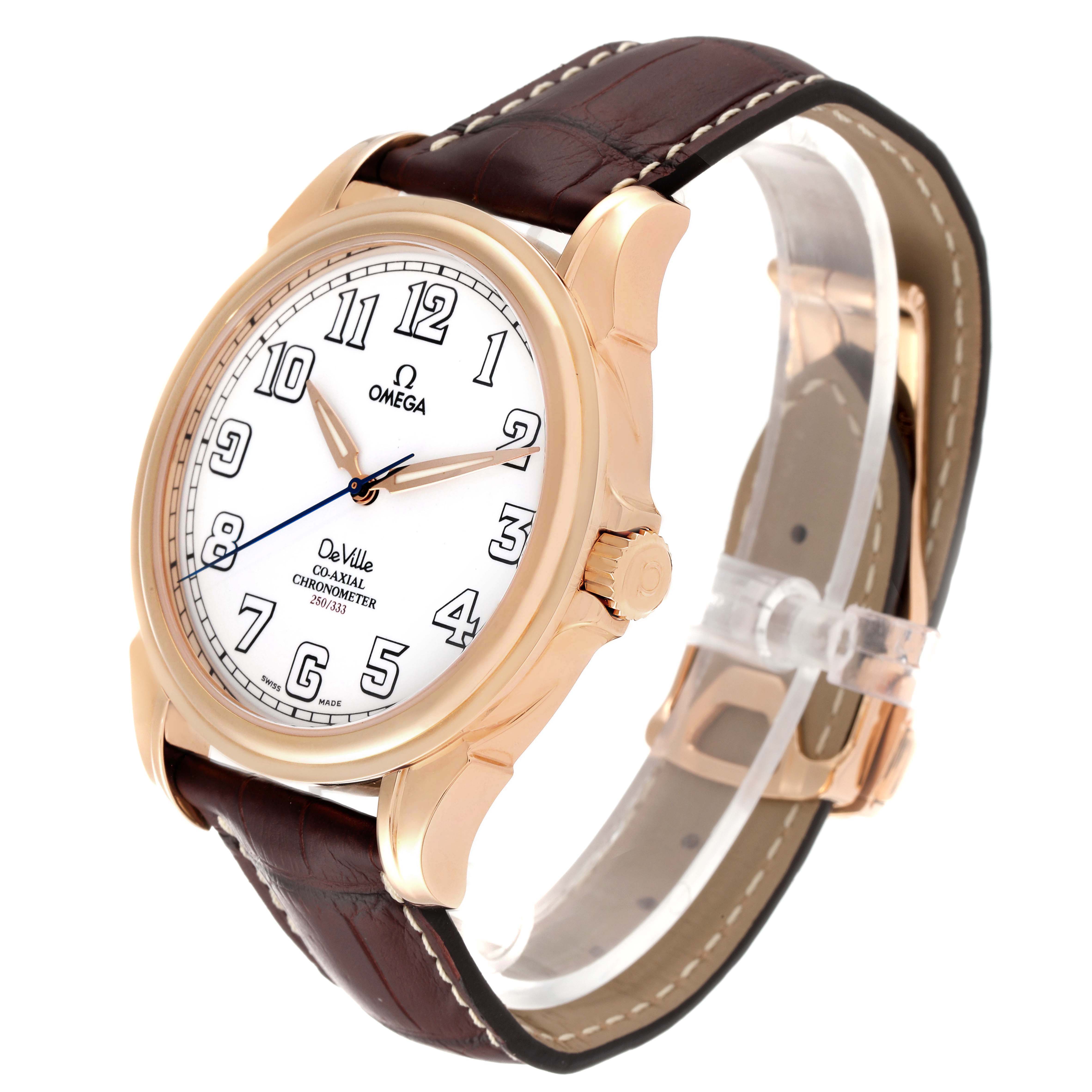 The image shows an angled view of the Omega De Ville 4660.20.32 Men's Rose Gold White Dial 4660.20.32 Men's Rose Gold White Dial watch, highlighting the face, crown, and leather strap.