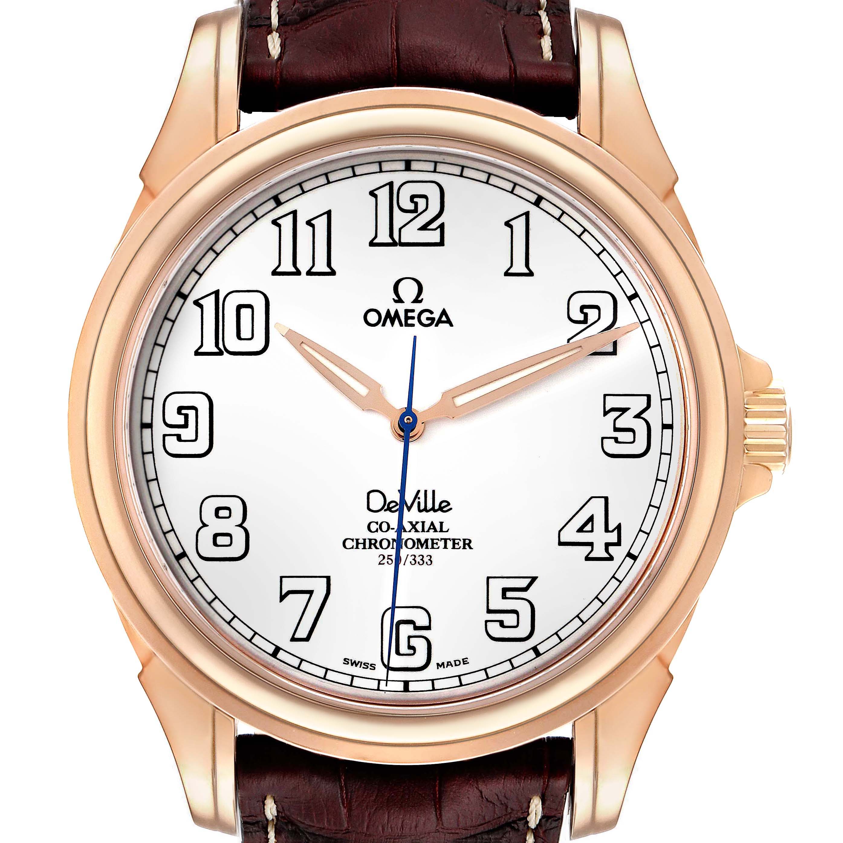 The image shows a close-up of the Omega De Ville 4660.20.32 Men's Rose Gold White Dial 4660.20.32 Men's Rose Gold White Dial watch face, highlighting its dial, hands, and brown leather strap.