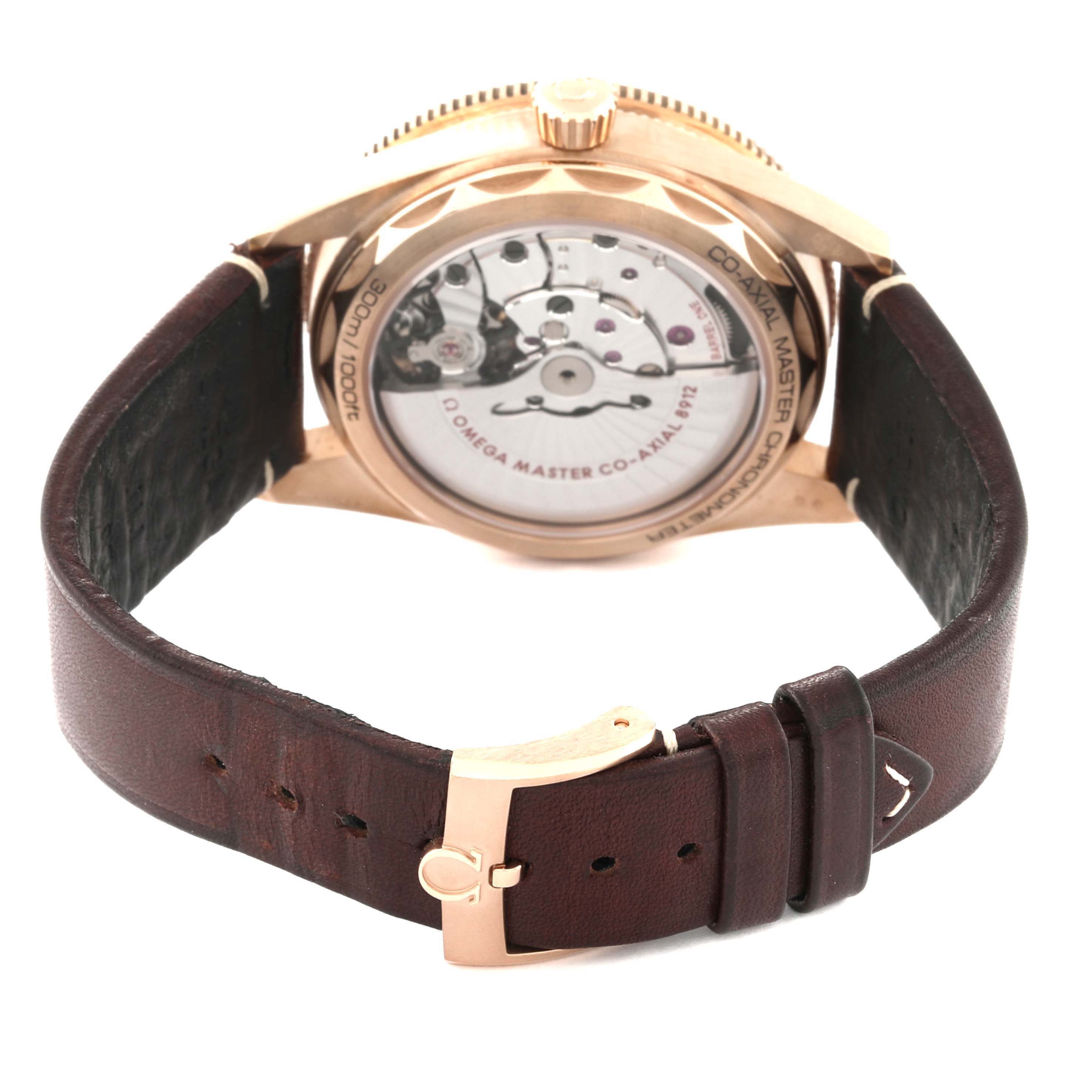 The Omega Seamaster 234.92.41.21.10.001 Men's Bronze Brown Dial 234.92.41.21.10.001 Men's Bronze Brown Dial watch is shown from the back, highlighting the movement and leather strap with a gold buckle.