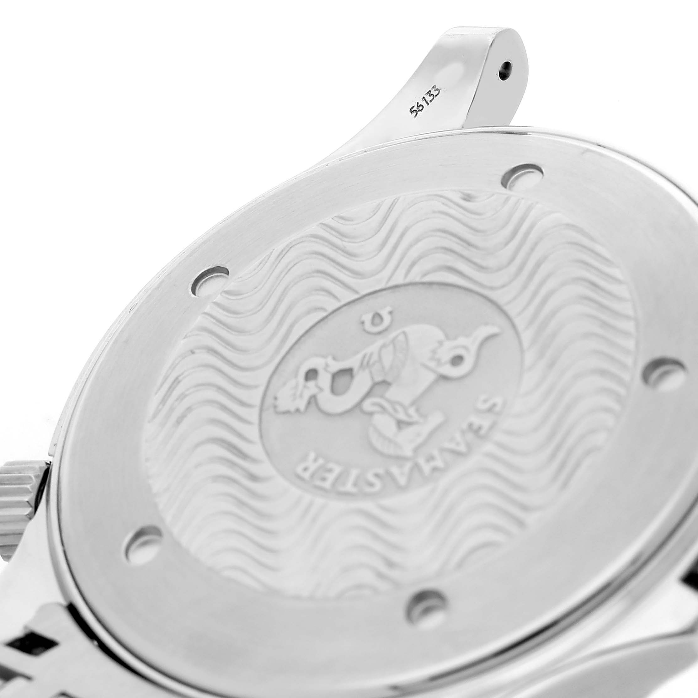 The image shows the case back of an Omega Seamaster 2541.80.00 Men's Stainless Steel Blue Dial watch, highlighting its engraved logo and wavy pattern.