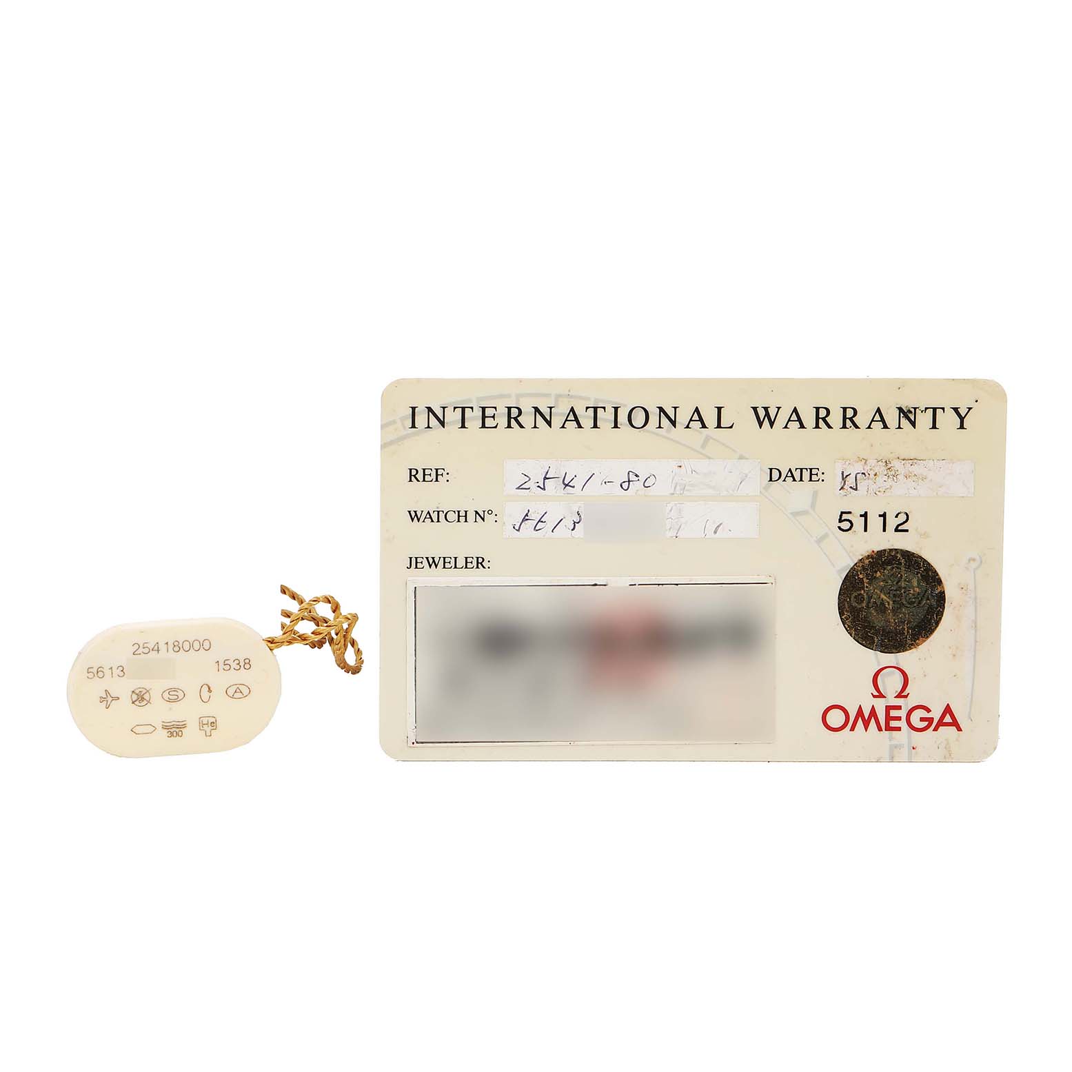 The image shows an Omega Seamaster 2541.80.00 Men's Stainless Steel Blue Dial international warranty card and a tag, photographed from above.