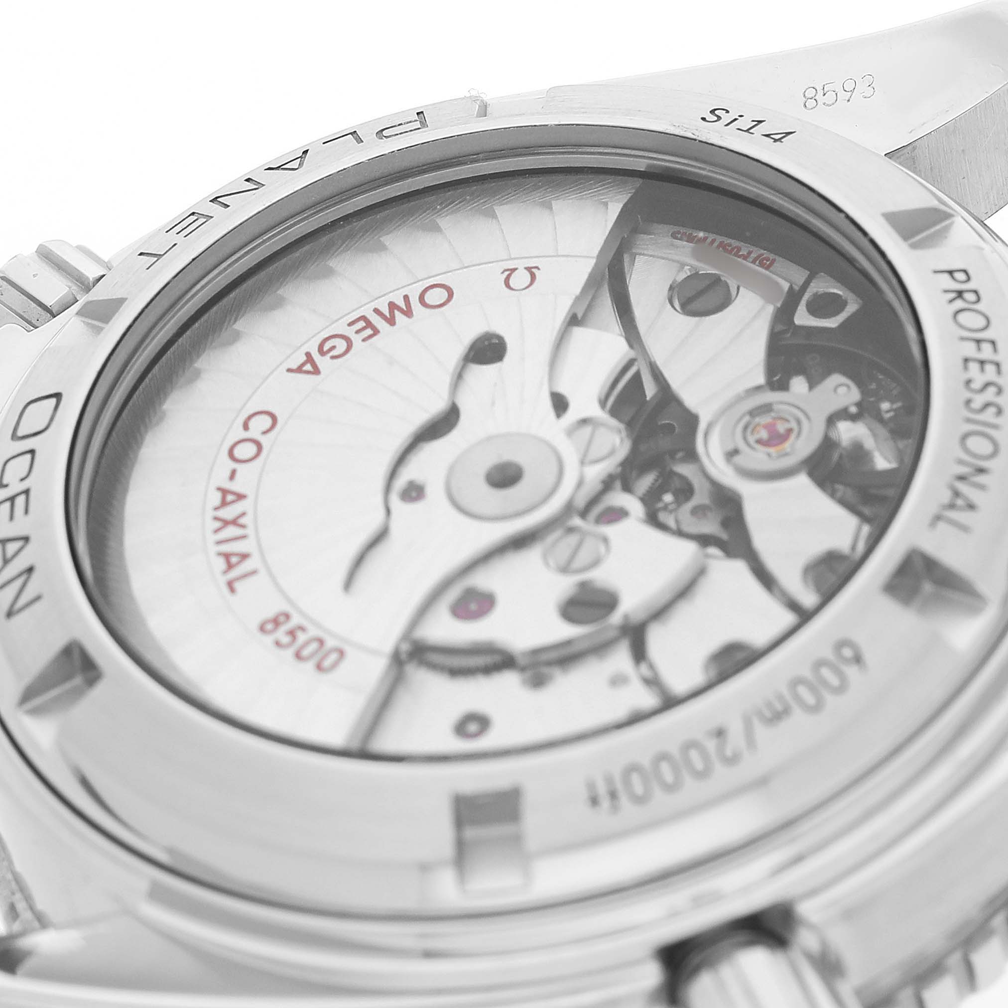The image shows a close-up of the Omega Planet Ocean 232.30.42.21.01.001 Men's Stainless Steel Black Dial's case back, highlighting the co-axial movement.