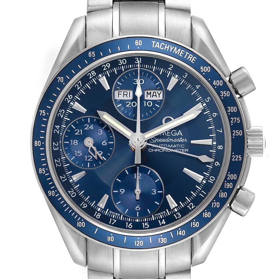 The Omega Speedmaster watch is shown from a front angle, displaying its blue dial with subdials, tachymeter, and date indicators.