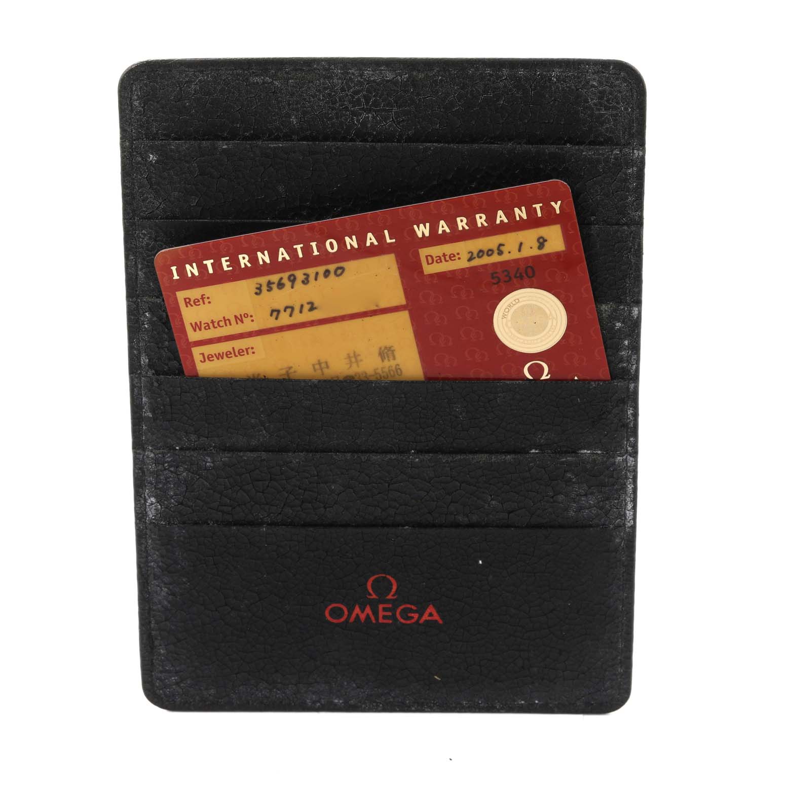 A close-up image shows an Omega Speedmaster 3569.31.00 Men's Stainless Steel Silver Dial 3569.31.00 Men's Stainless Steel Silver Dial International Warranty card in a black leather cardholder.