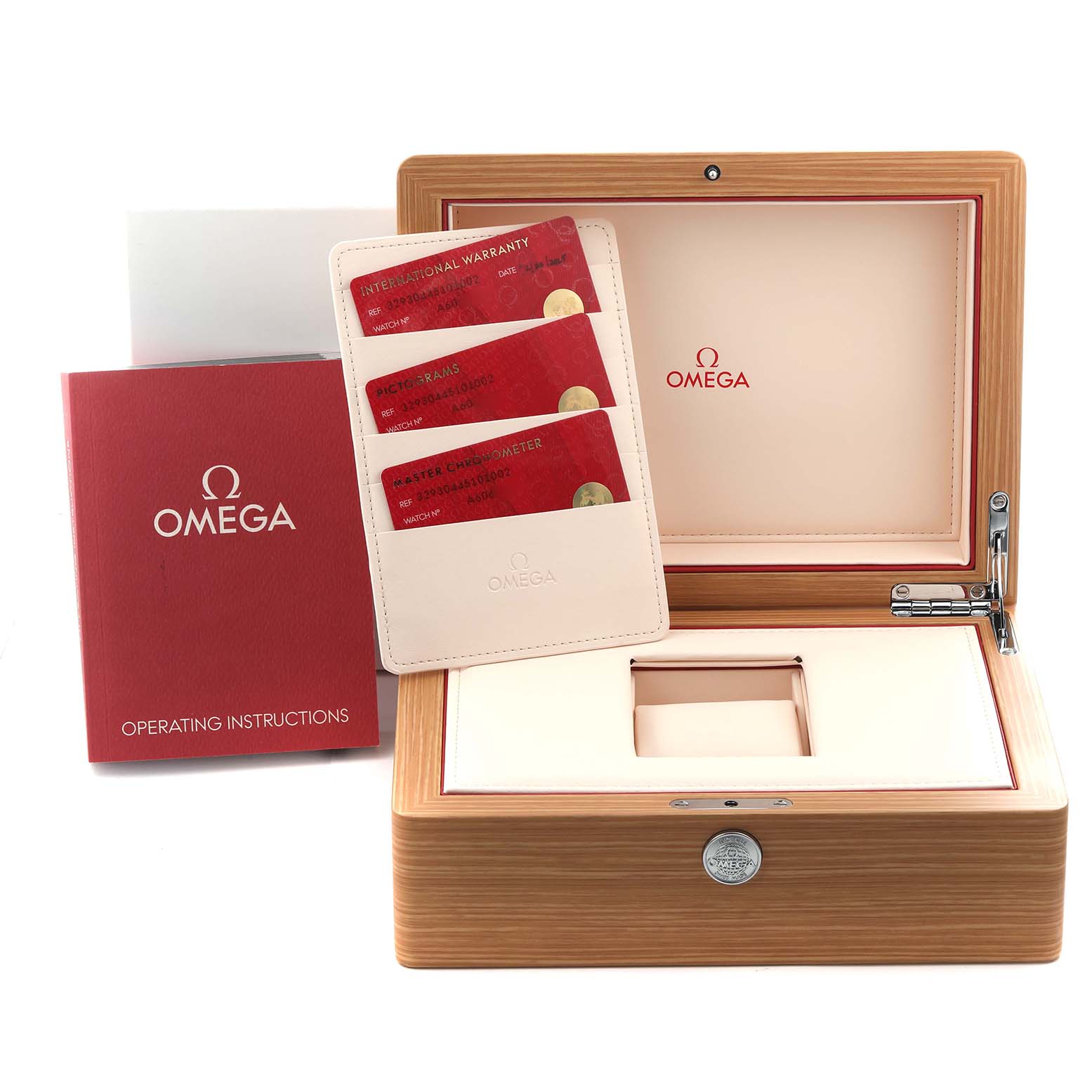 The Omega Speedmaster 329.30.44.51.01.002 Men
s Stainless Steel Black Dial 329.30.44.51.01.002 Men
s Stainless Steel Black Dial accessories shown include the wooden box, warranty cards, and operating manual, all seen from above.