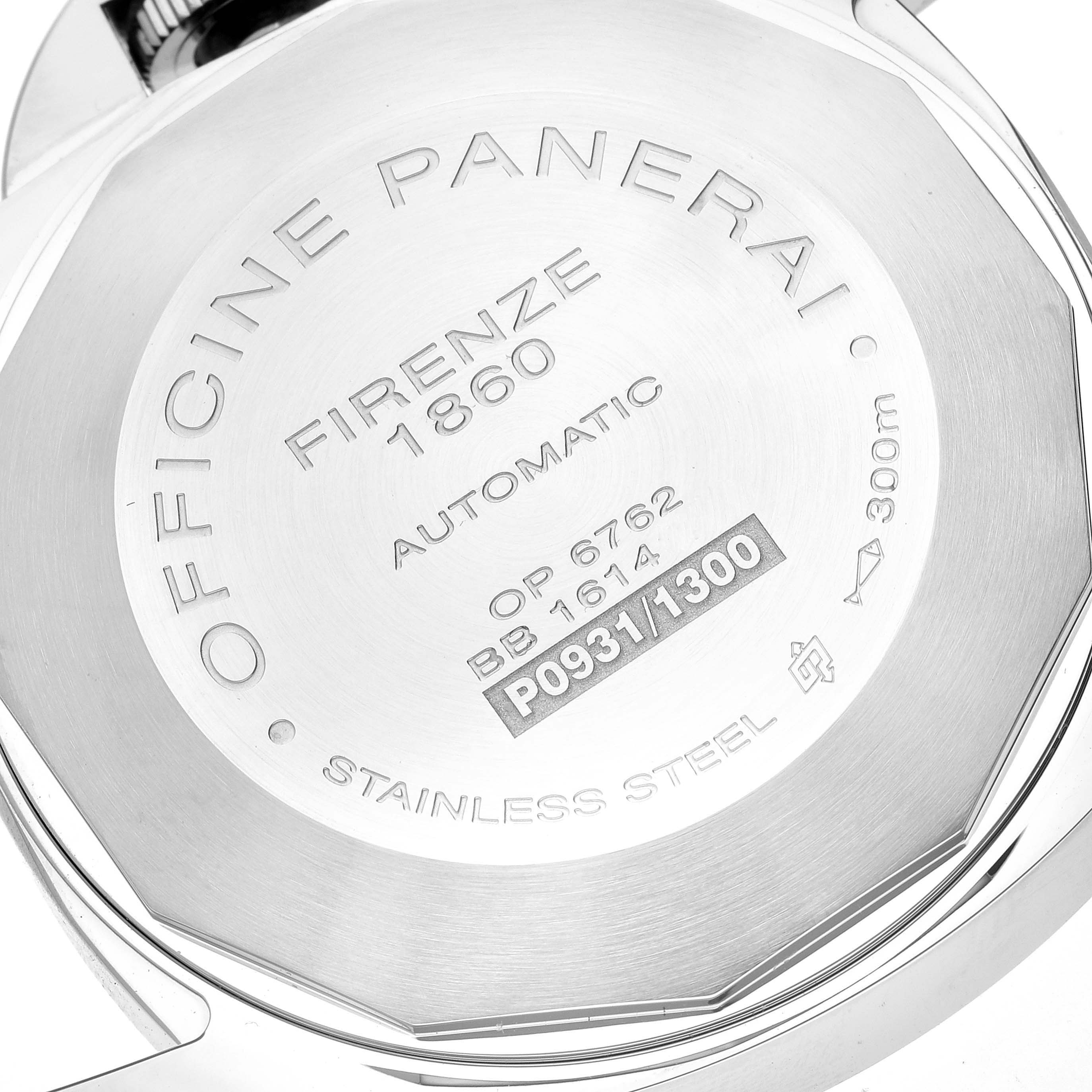 The image shows the back case of a Panerai Luminor PAM00090 Men
s Stainless Steel Black Dial PAM00090 Men
s Stainless Steel Black Dial watch, highlighting engravings and serial numbers.