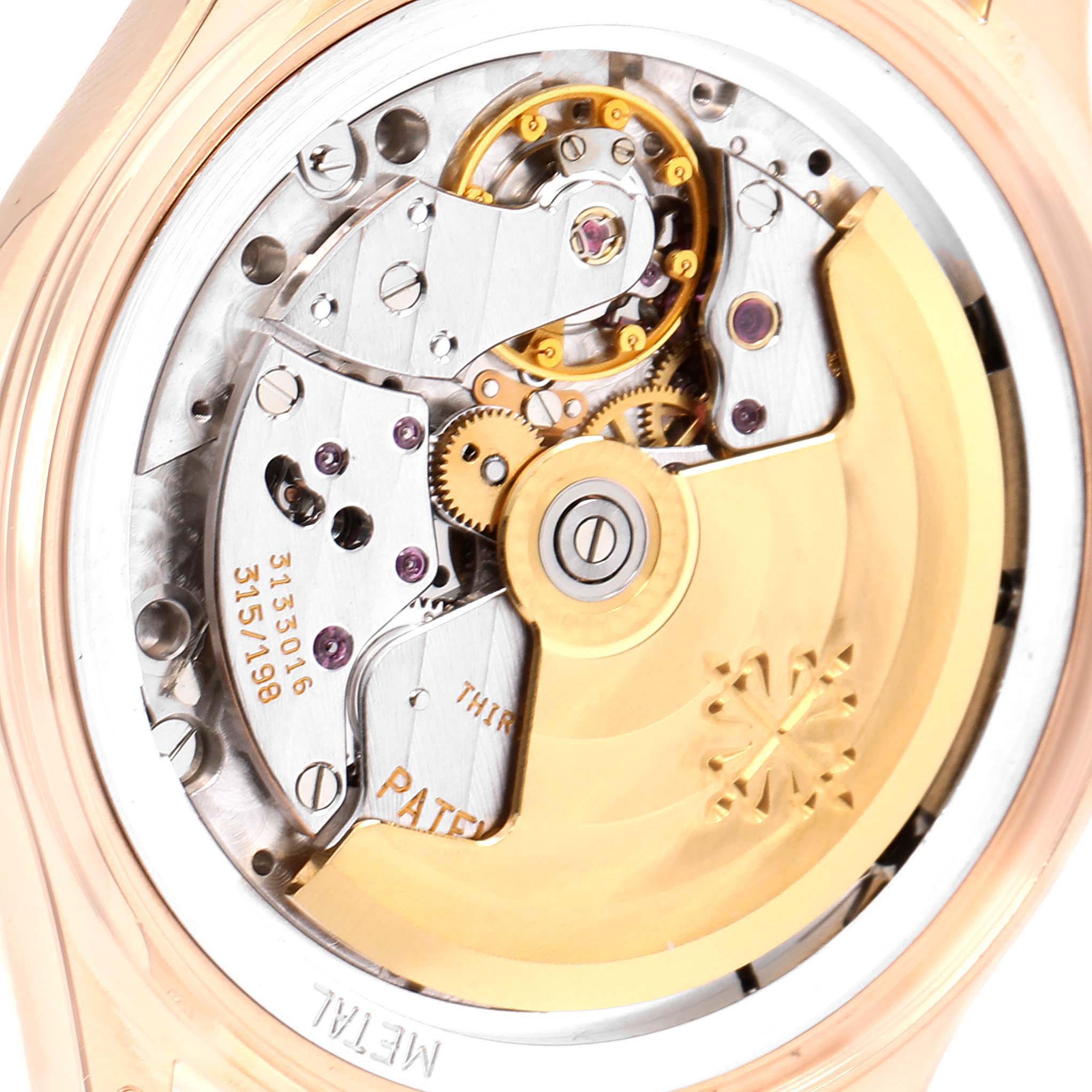 This image shows the intricate movement and internal components of a Patek Philippe Complications 5035R Men's Rose Gold Silver Dial 5035R Men's Rose Gold Silver Dial watch from a rear angle.