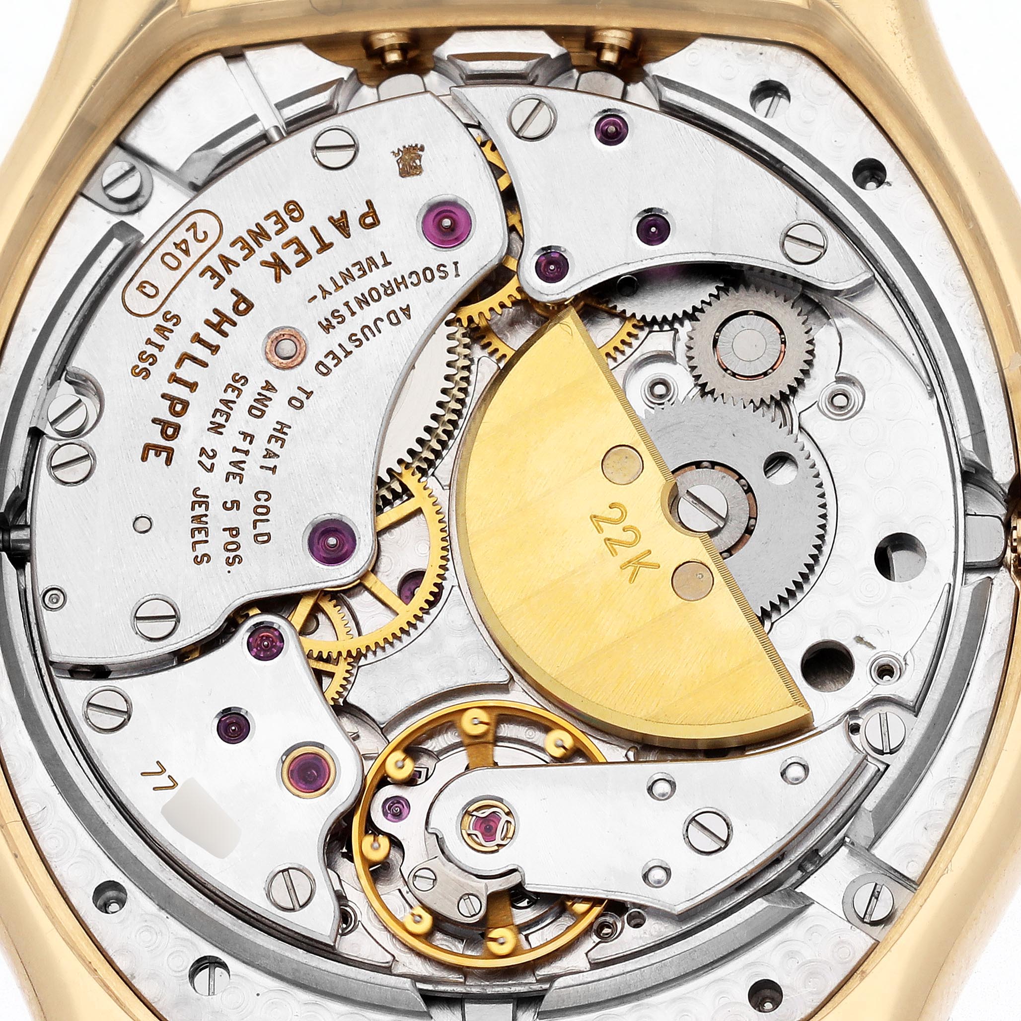 The image shows the rear view of a Patek Philippe Complications 5040J Men
s Yellow Gold Silver Dial 5040J Men
s Yellow Gold Silver Dial model, highlighting the intricate movement and 22K gold rotor.