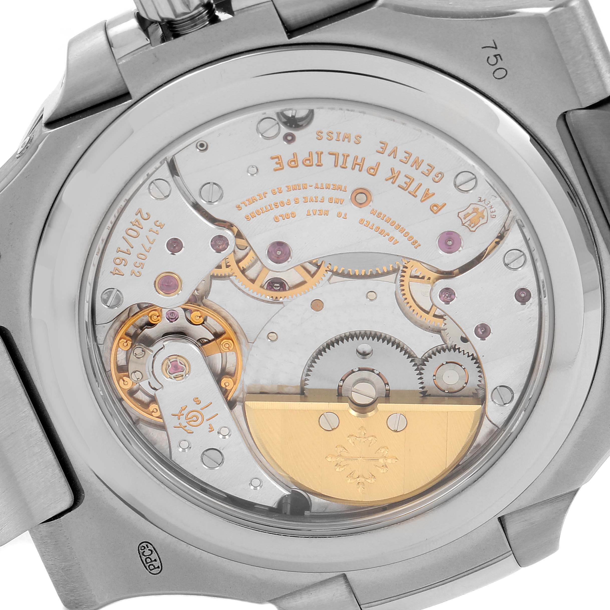 This image shows the caseback of a Patek Philippe Nautilus 5712G/001 Men
s White Gold Grey Dial 5712G/001 Men
s White Gold Grey Dial watch, displaying its intricate mechanical movement.