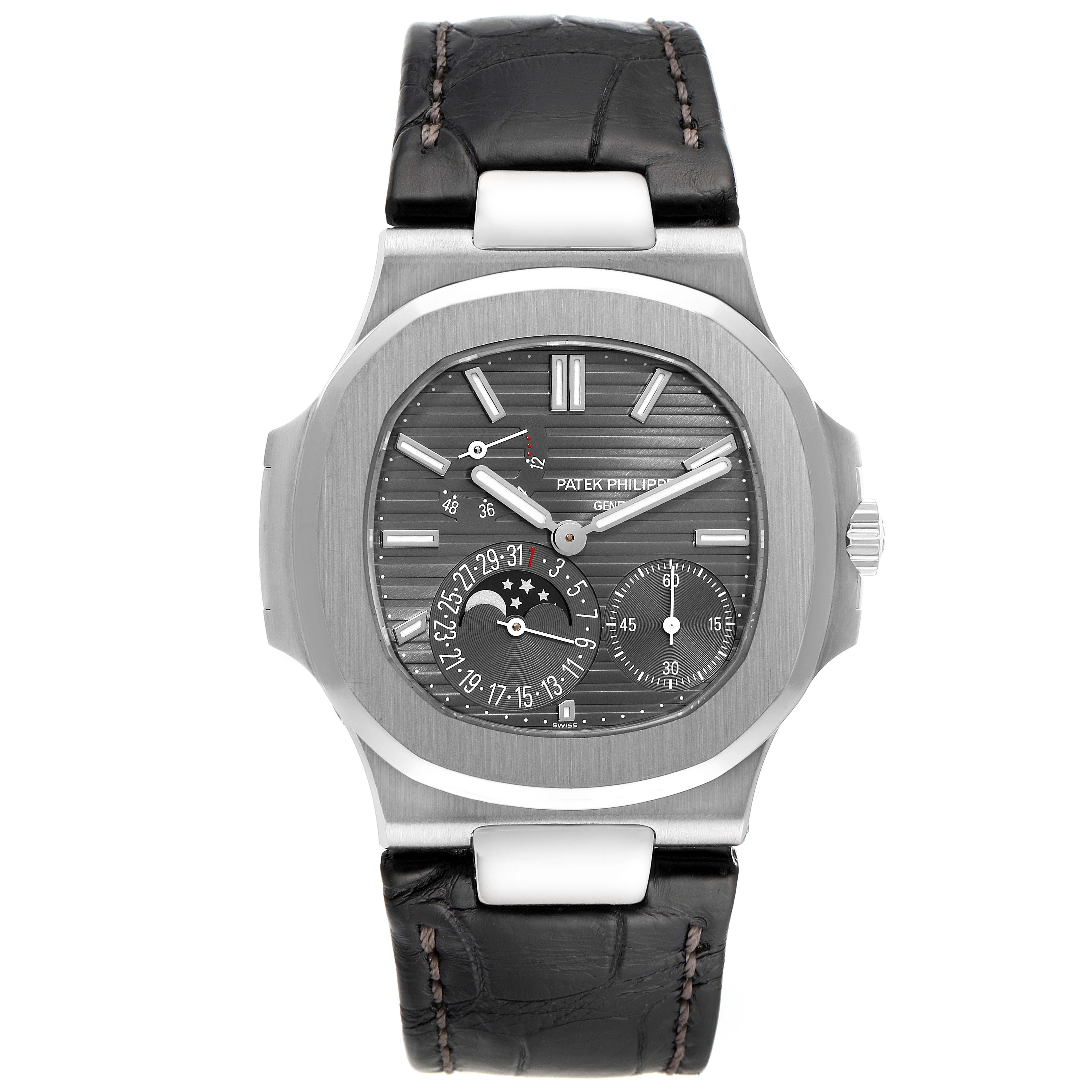 The image shows a front view of a Patek Philippe Nautilus 5712G/001 Men
s White Gold Grey Dial 5712G/001 Men
s White Gold Grey Dial watch, displaying its face, hands, sub-dials, bezel, crown, and leather strap.