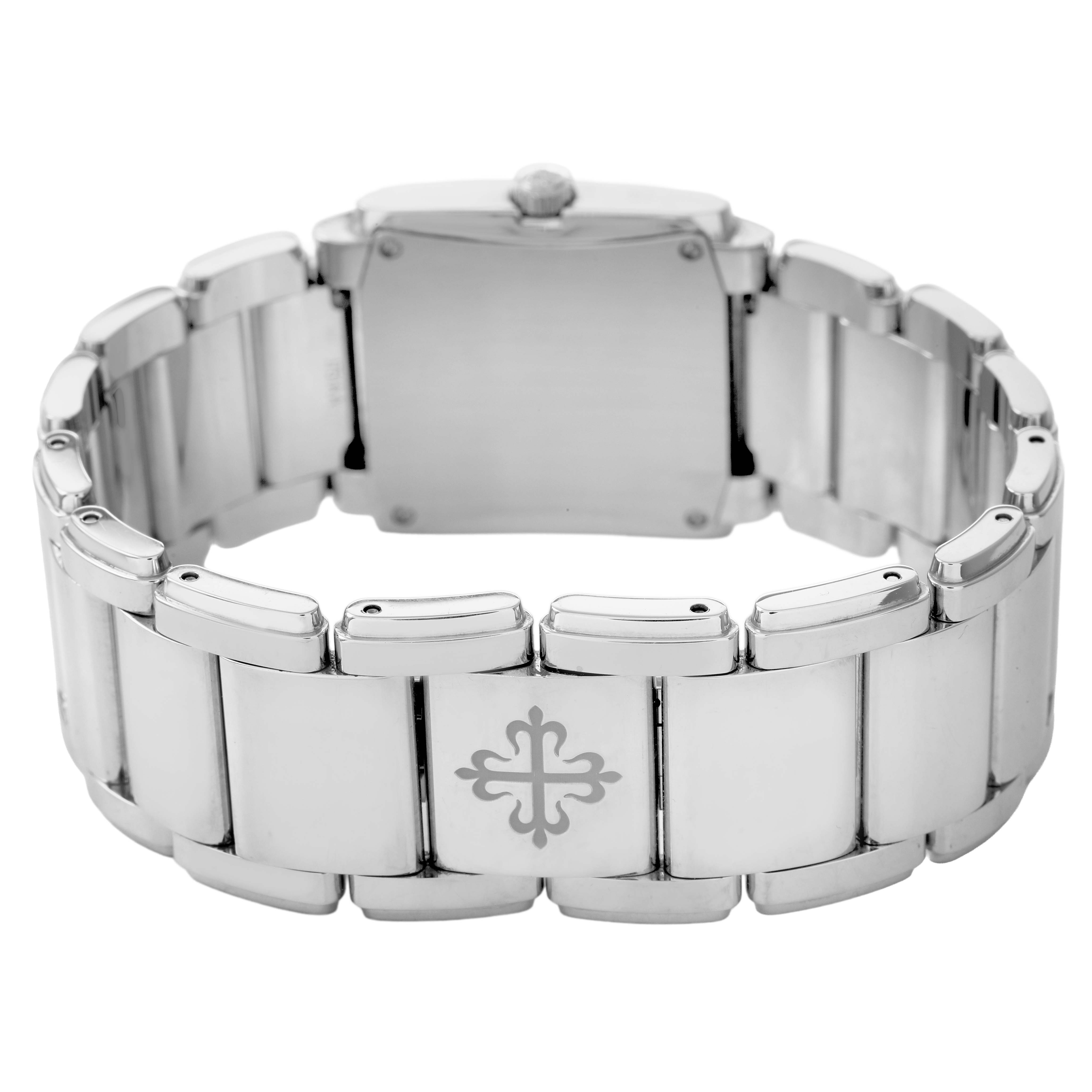 The image shows the back and clasp of a Patek Philippe Twenty-4 4910 Women's Stainless Steel Blue Dial watch, highlighting the bracelet links and emblem.