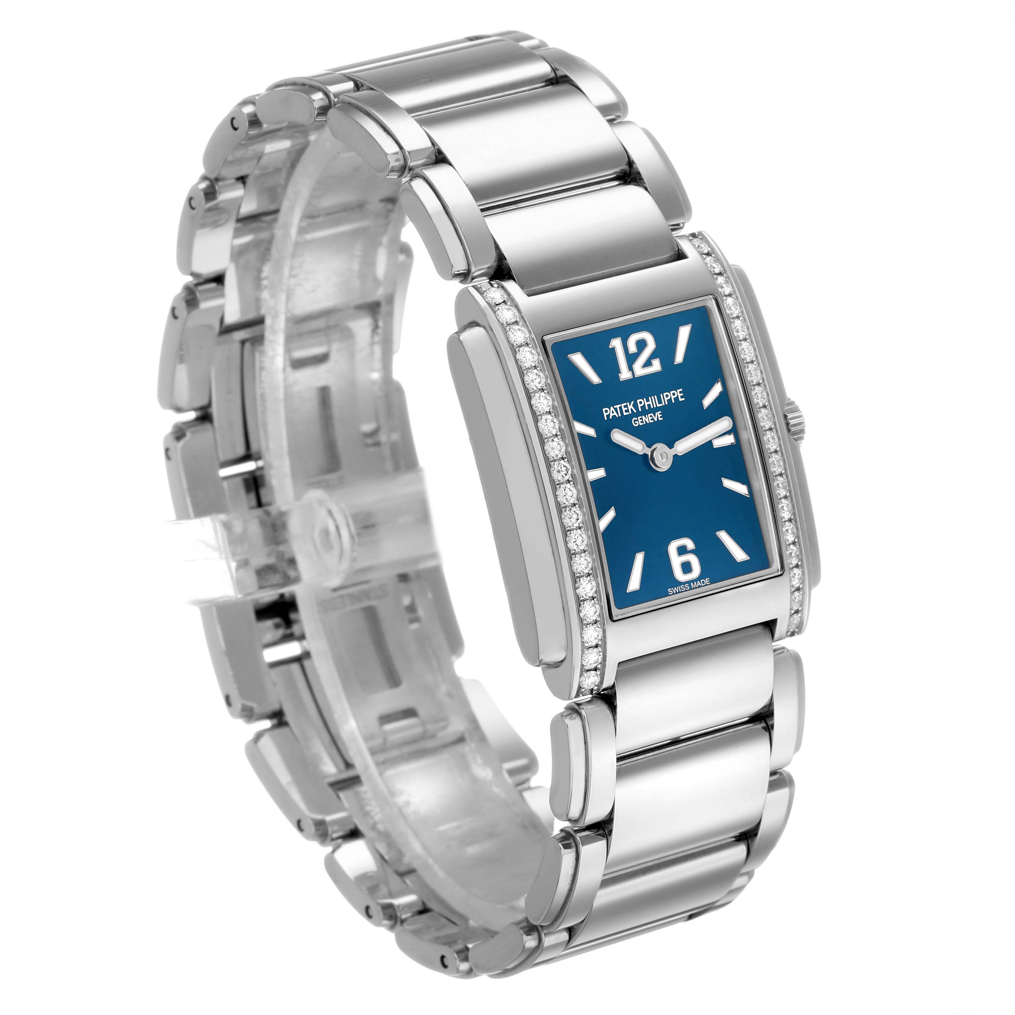 The image shows a side angle of the Patek Philippe Twenty-4 4910 Women's Stainless Steel Blue Dial watch, focusing on the bracelet and dial with diamond accents on the bezel.