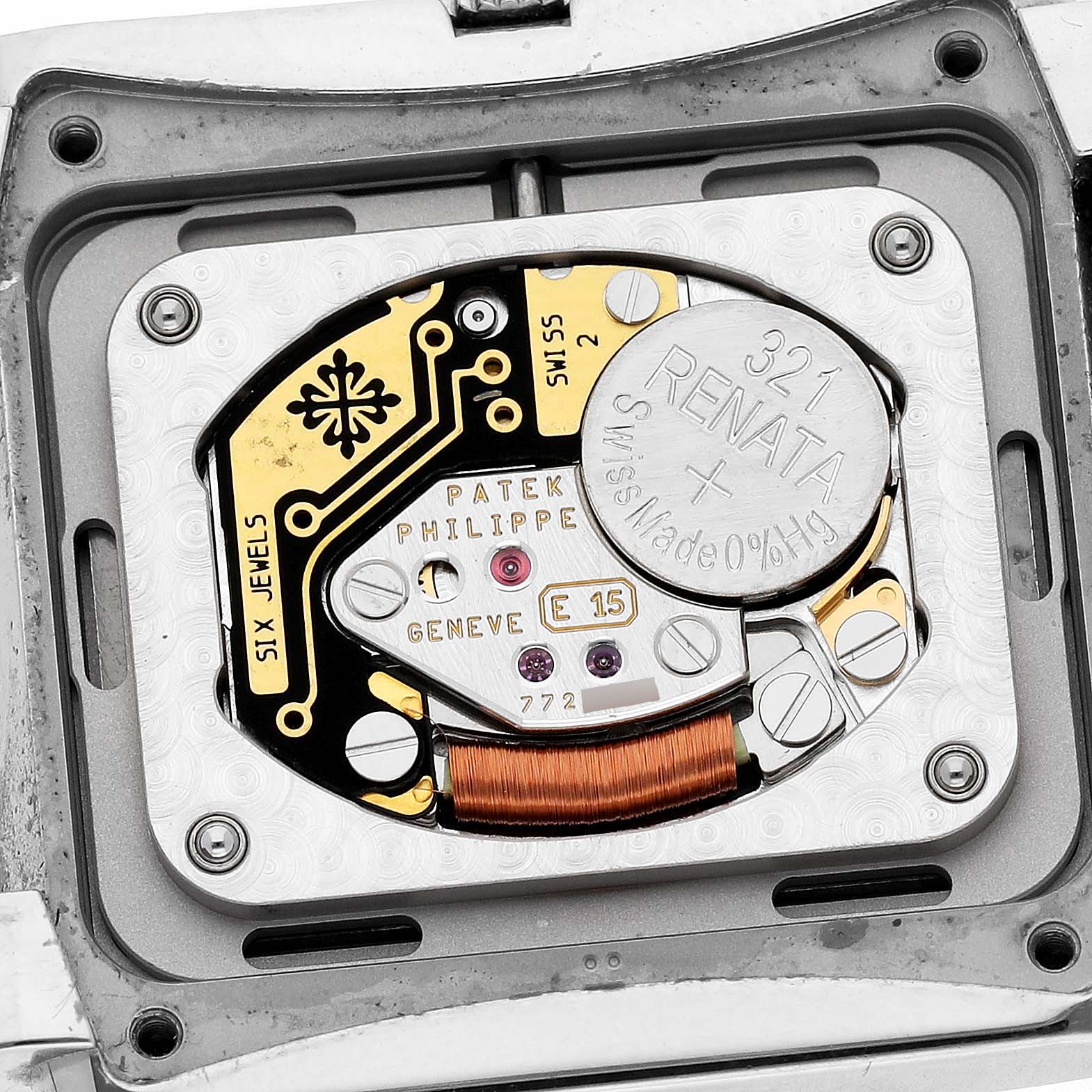 The image shows a close-up of the movement and battery inside a Patek Philippe Twenty-4 4910 Women's Stainless Steel Blue Dial watch.