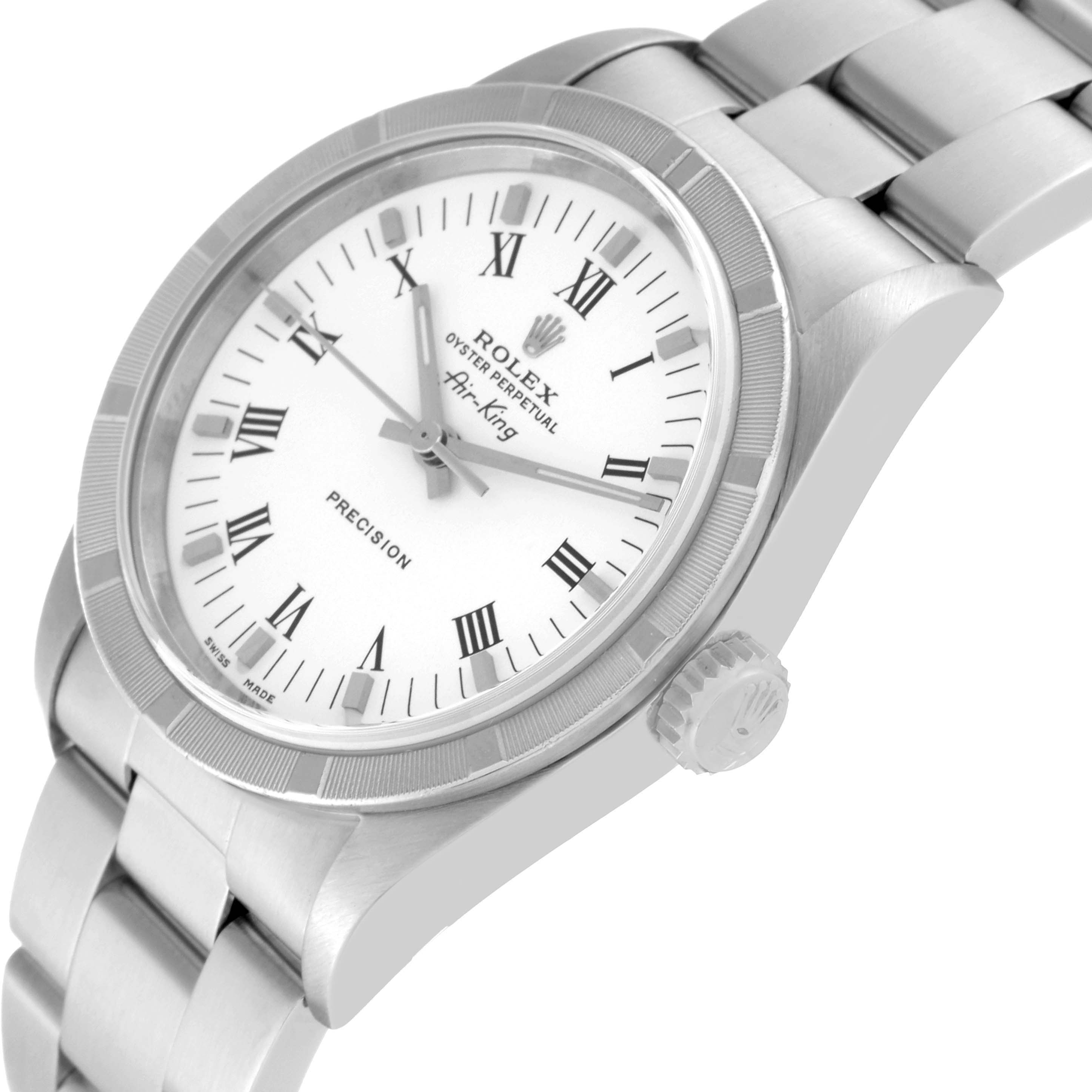 The Rolex Air-King 14010M Men's Stainless Steel White Dial 14010M Men's Stainless Steel White Dial watch is shown from an angled side view, highlighting its bezel, crown, and part of the bracelet.