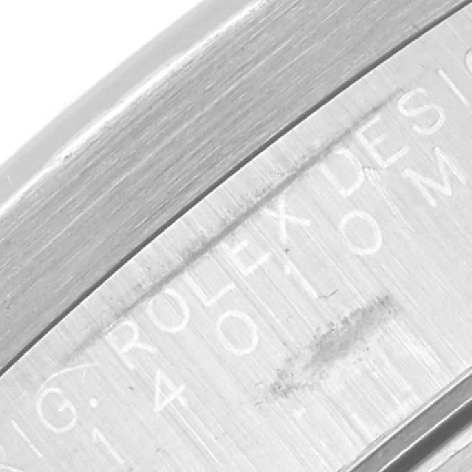 This image shows a close-up of the side of the Rolex Air-King 14010M Men's Stainless Steel White Dial 14010M Men's Stainless Steel White Dial watch, highlighting the engraved text on the case.
